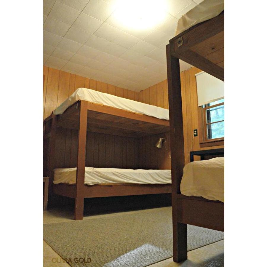 Each cabin has 1 master bedroom with a queen bed & another large bedroom with 4 double beds