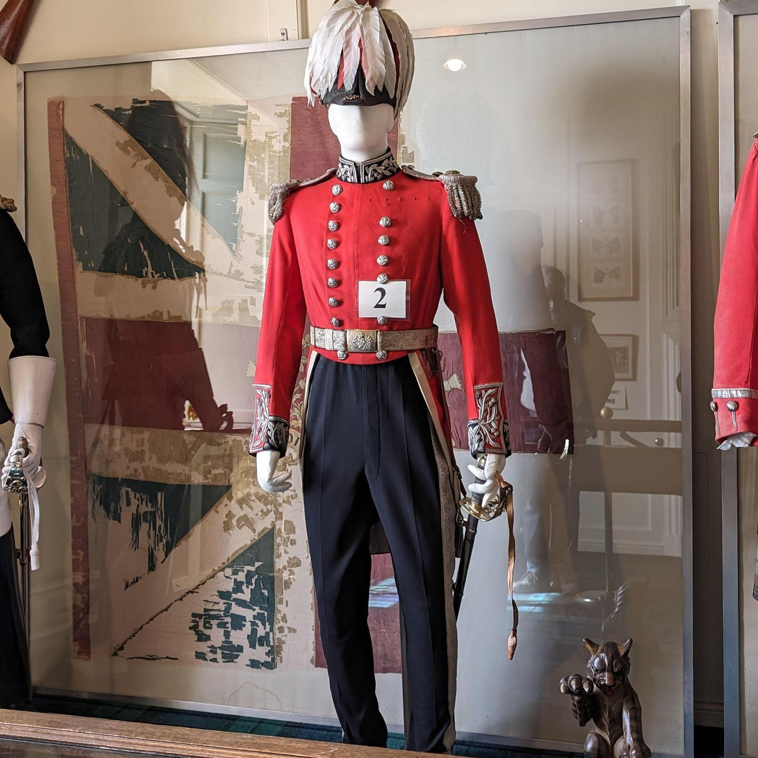 A military uniform with a shorter hat.