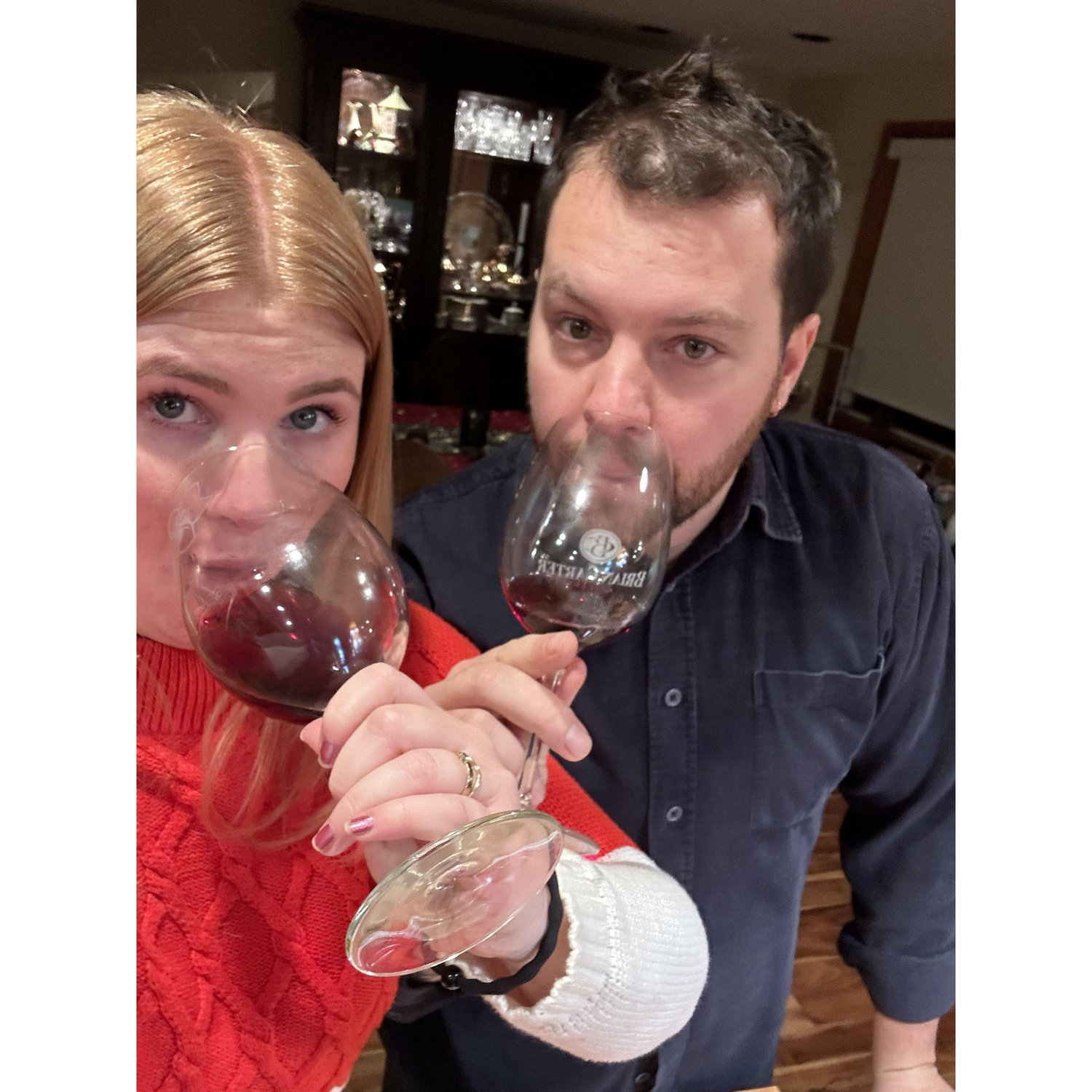 Drinking wine and being big goofs.