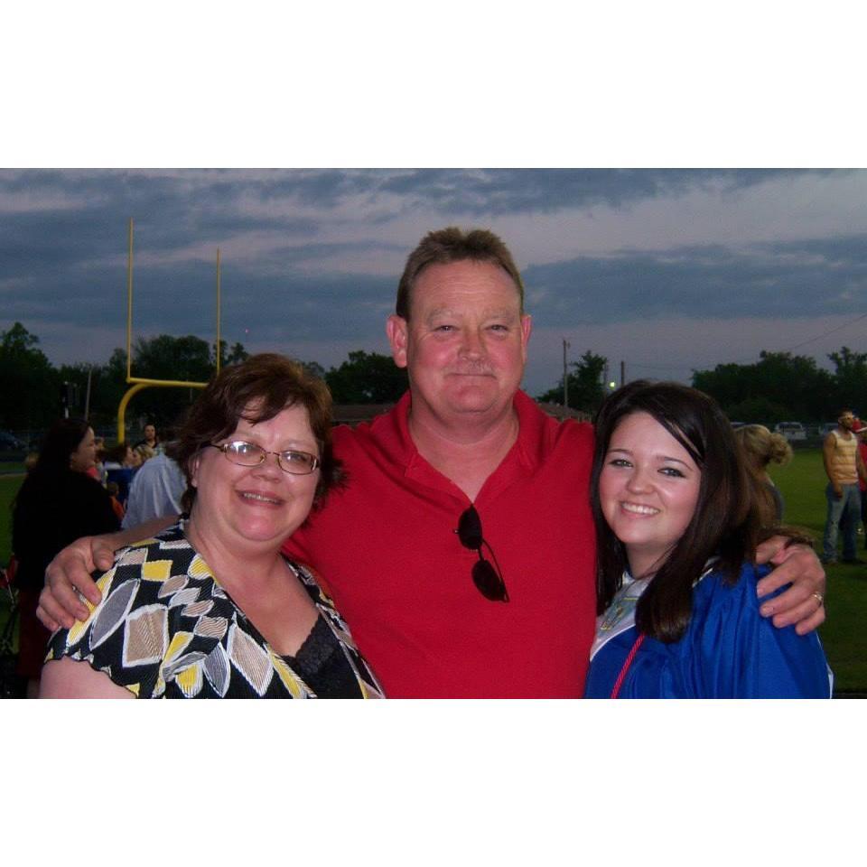 This is the only picture in existence of all three of them together, we figured we should include it. This is the brides graduation photo with both her mom and dad.