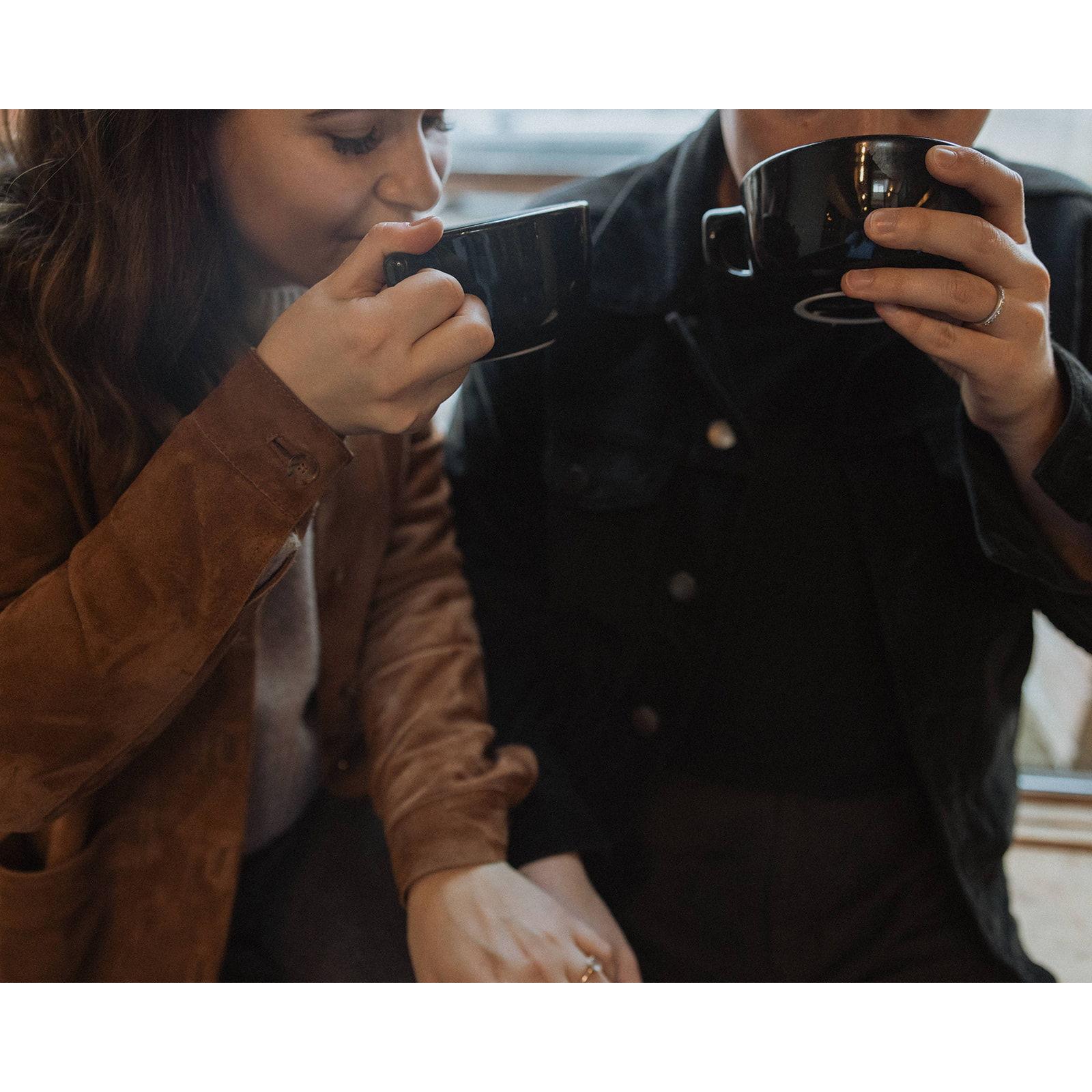 Engagement photos by In the Alpenglow at Bluebeard Coffee Roasters on a rainy day in Tacoma, Wahington in the fall of 2023.