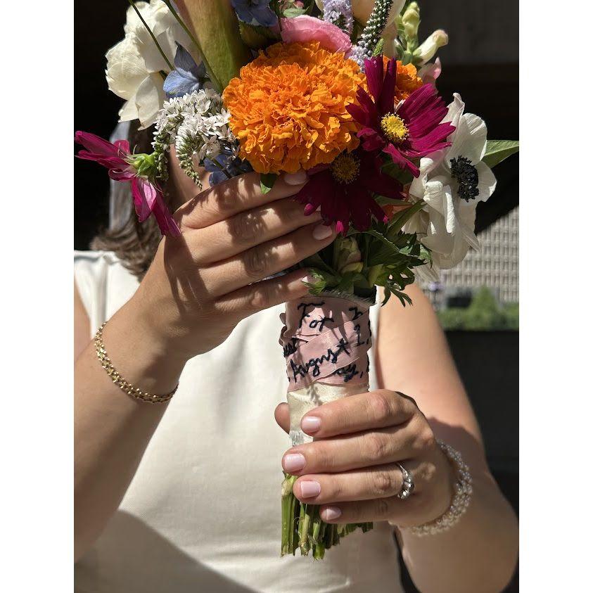 Bouquet made with love by Merrill's childhood best friends, Emma & Nelle, with an incredibly beautiful hand stitched letter on ribbon.