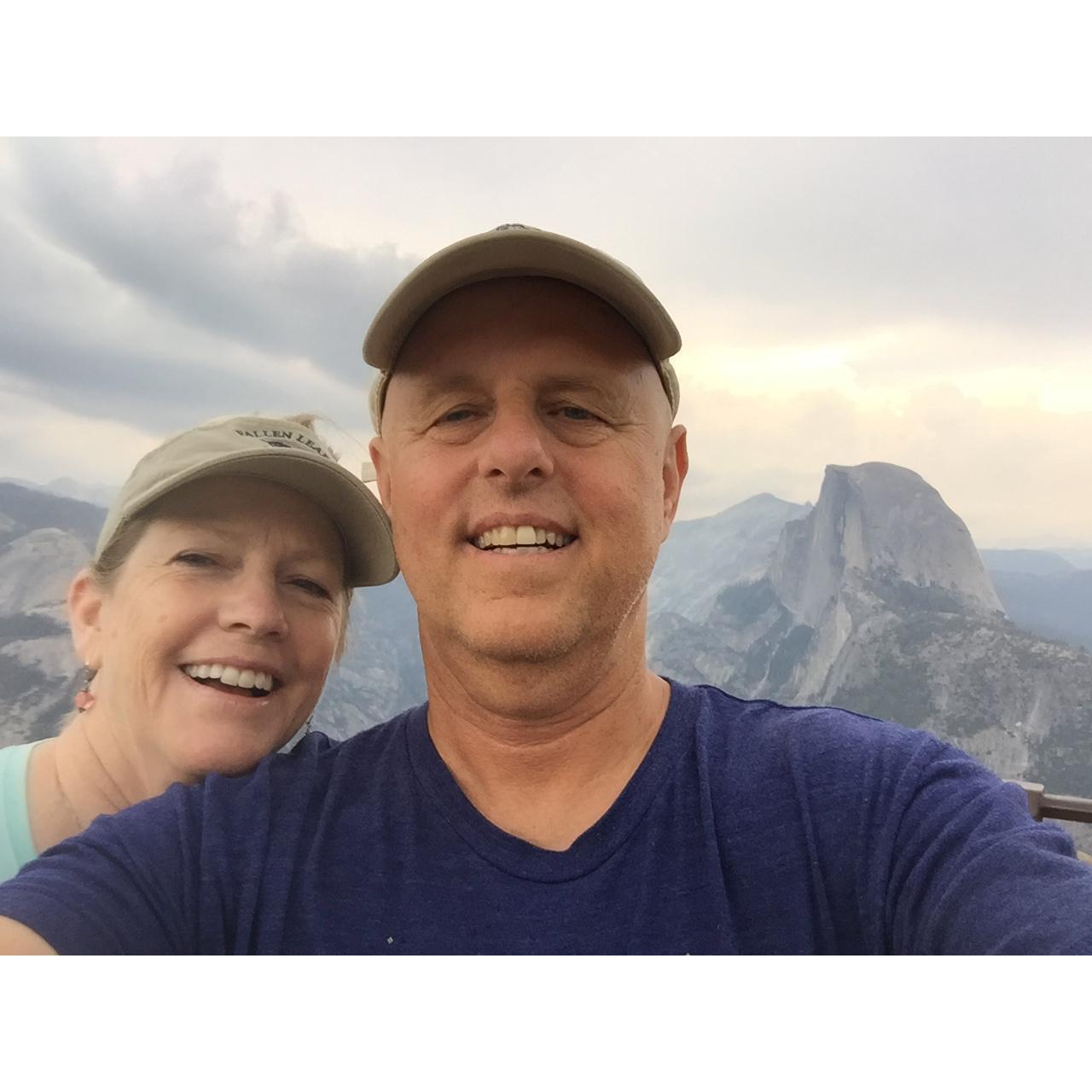 Wade showing Jan the amazing views from Glacier Point with a view of Half Dome.