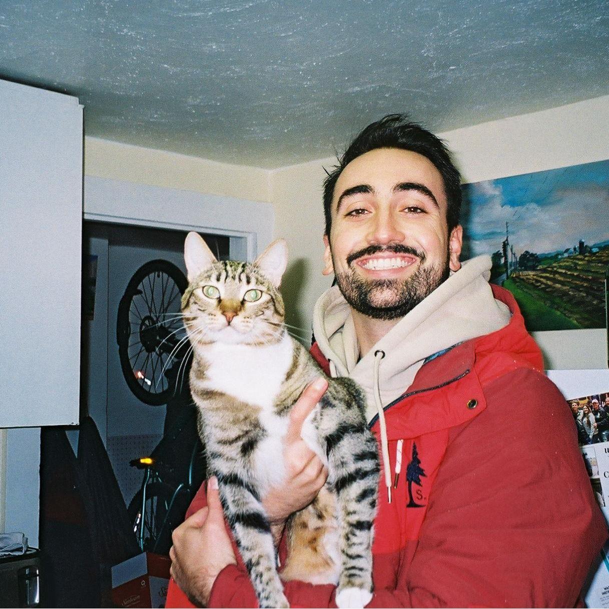 Tim and Cheeto Puff in Paige's apartment in Corning, NY. 

During quarantine we were able to work from home together in Corning. That apartment was cozy for two people and a cat!