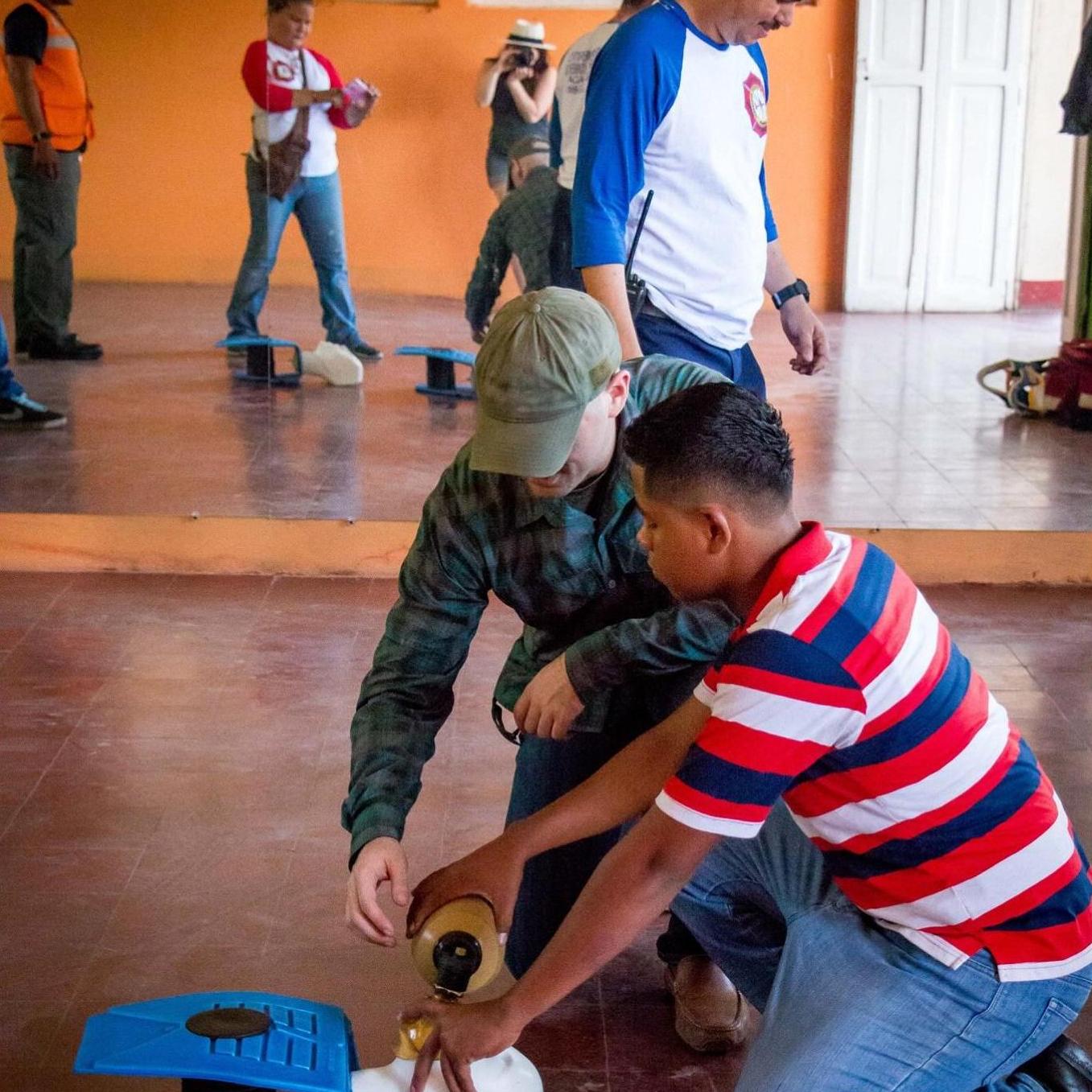 Steven teaching CPR on a trip to Nicaragua. Lily taking photos in the background and translating in Spanish when gestures weren't cutting it.