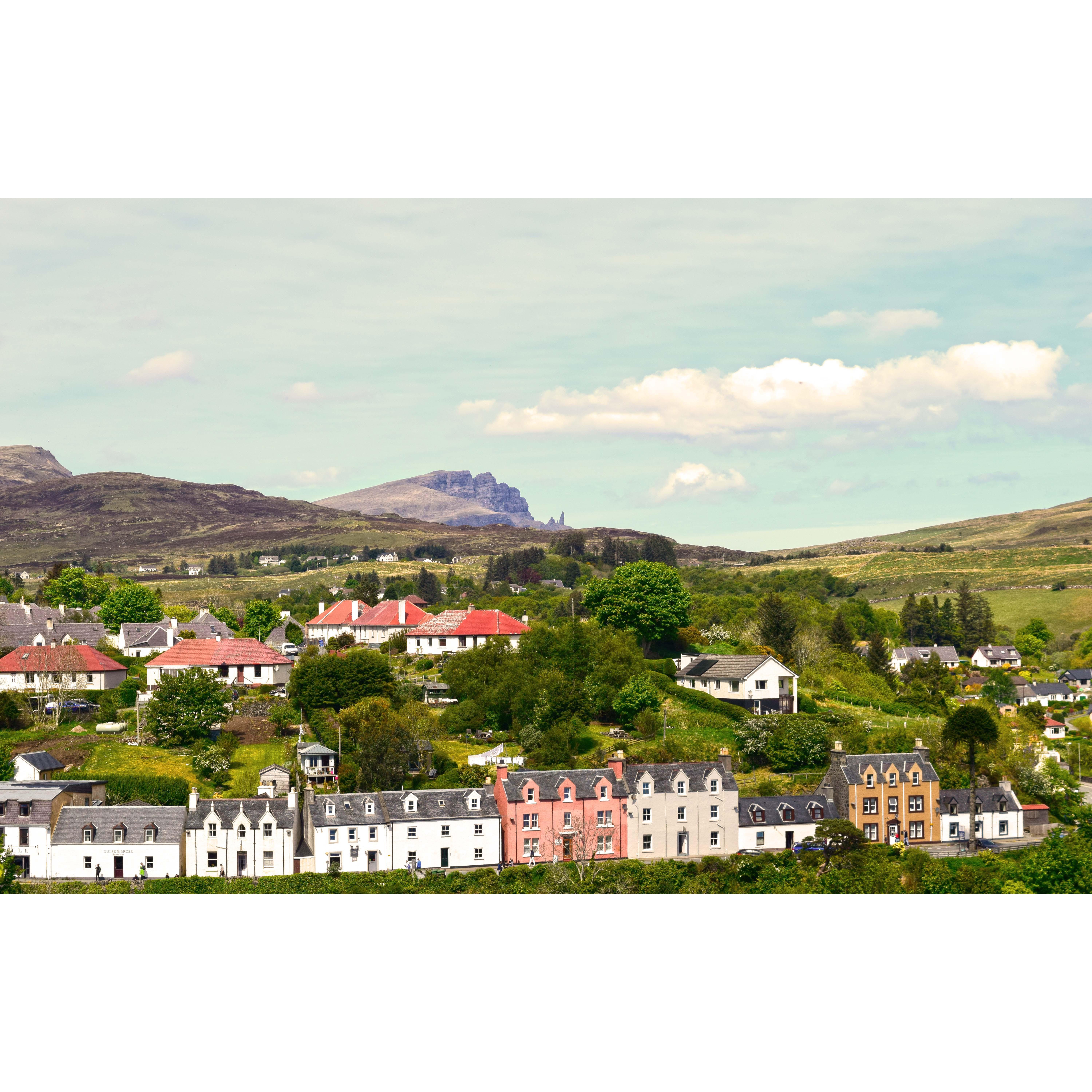 Day 4- After a train, boat, & cab, we arrive at Portee on Skye. Old Man of Storr is that rocky terrain in the distance. We climb that the next day. Yes, on another gloriously made Scotland trail :)