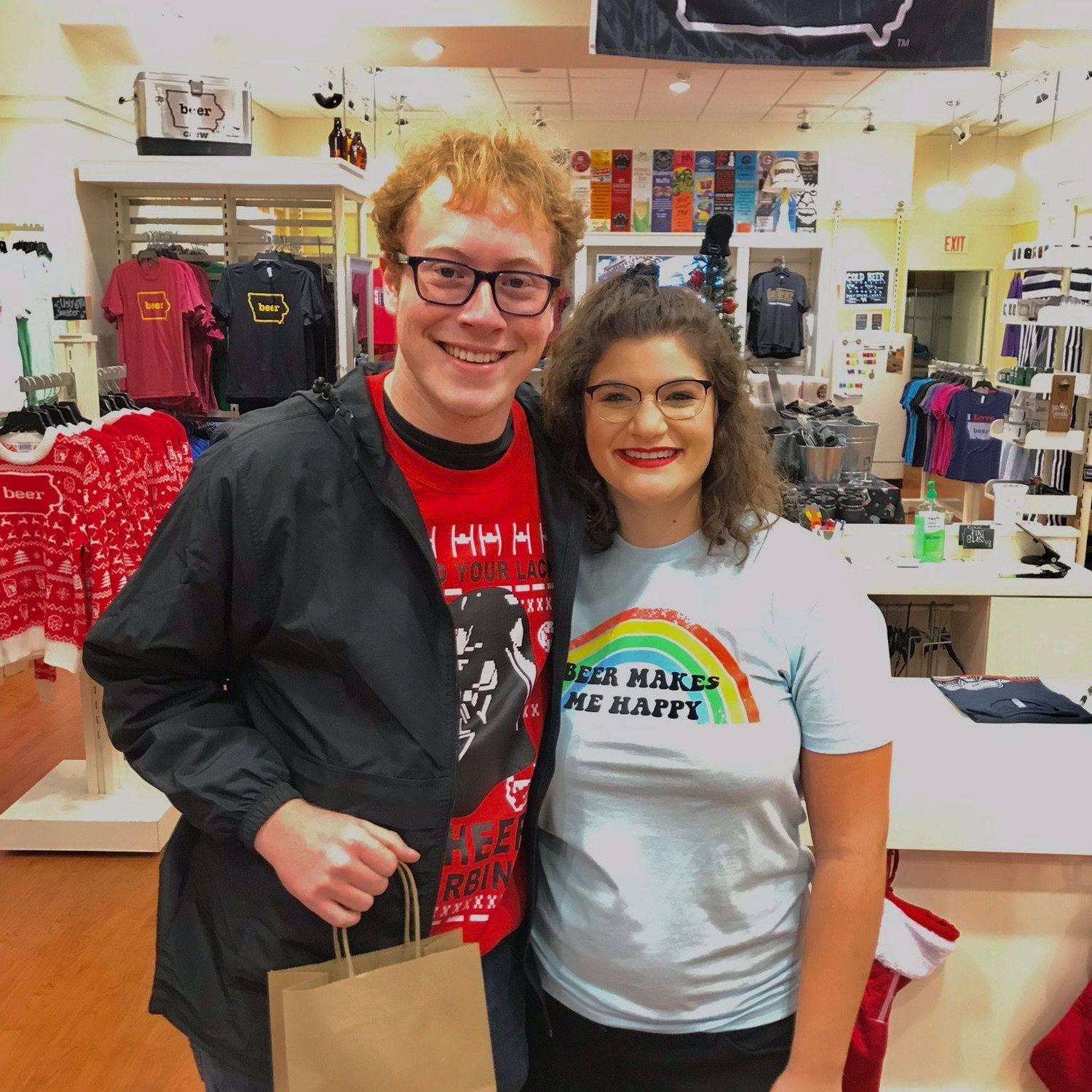 Nov 2019: Saylor visits Leigh at work at the Iowa Craft Beer Tent store! He brought his Mom, Erin, to meet her. Afterwards she said "why haven't you asked her out yet?!" He did a few days later.
