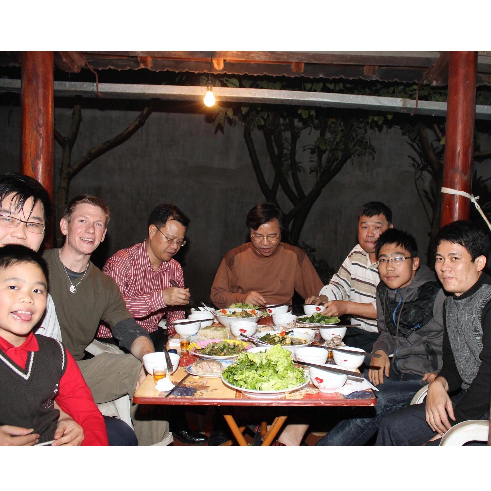 Enjoying Lunar New Year dinner in Vietnam with the host family.