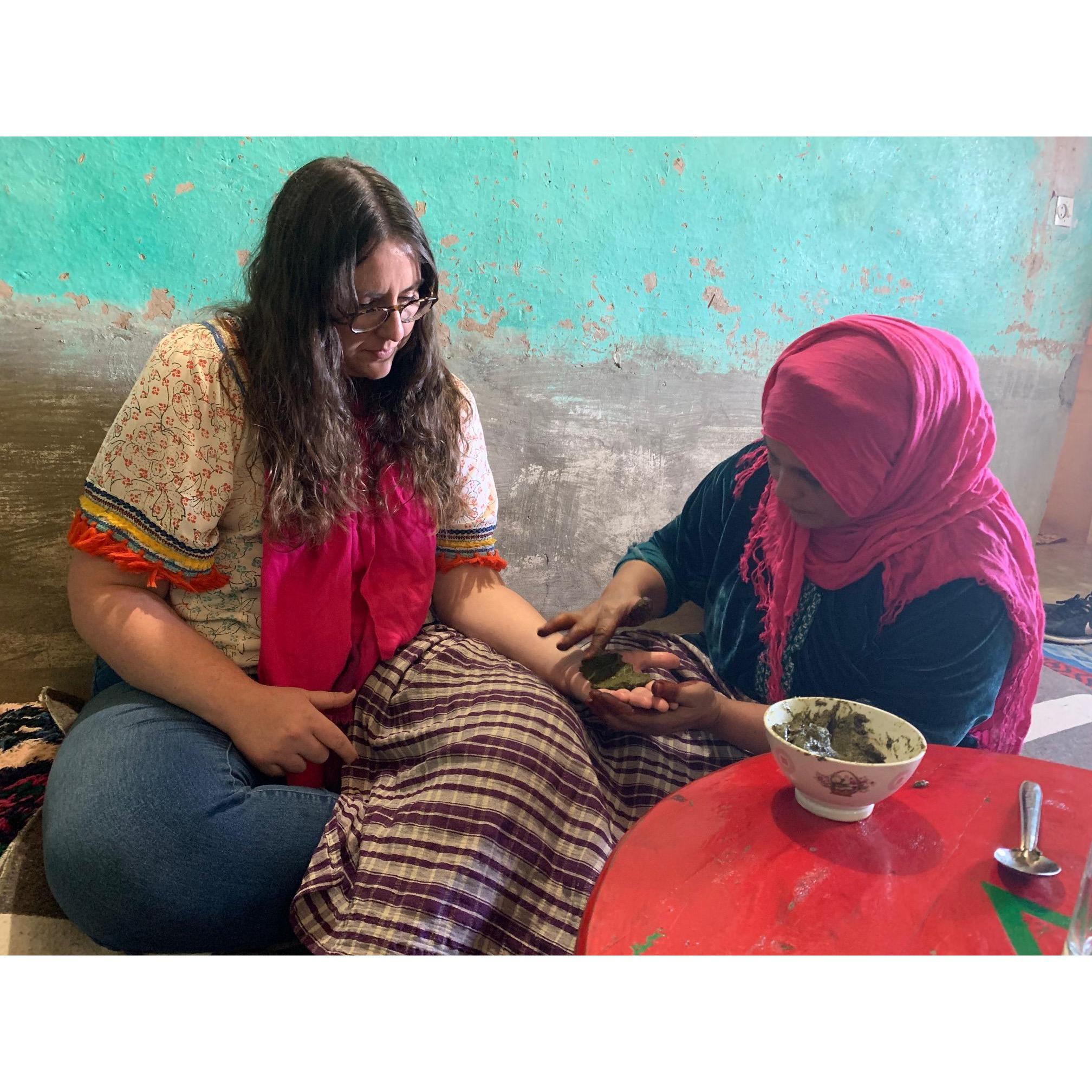 Youssef's mom doing henna on Emily's palms, December 2020.