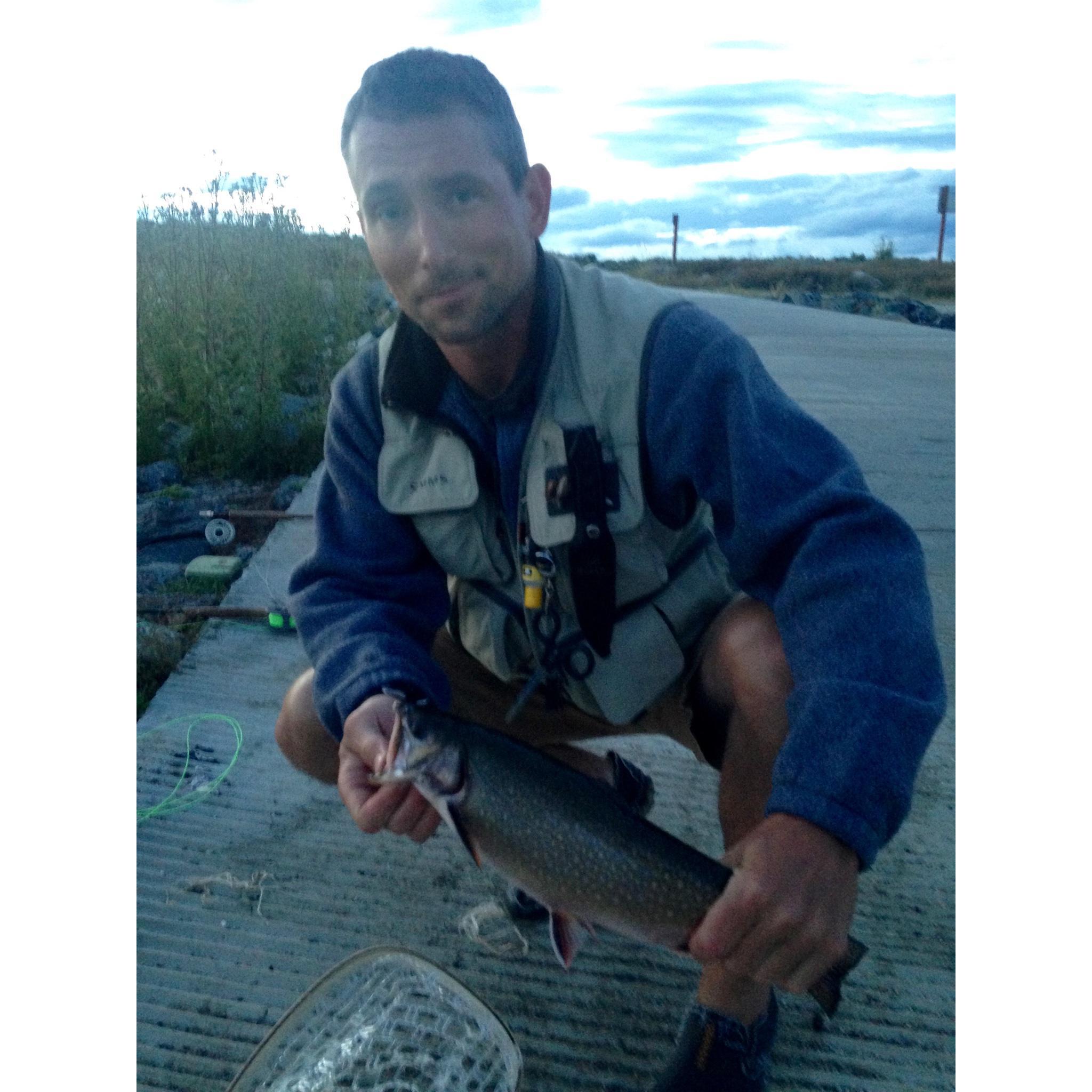 Our very first date! Sarah let Brian pose with her fish...