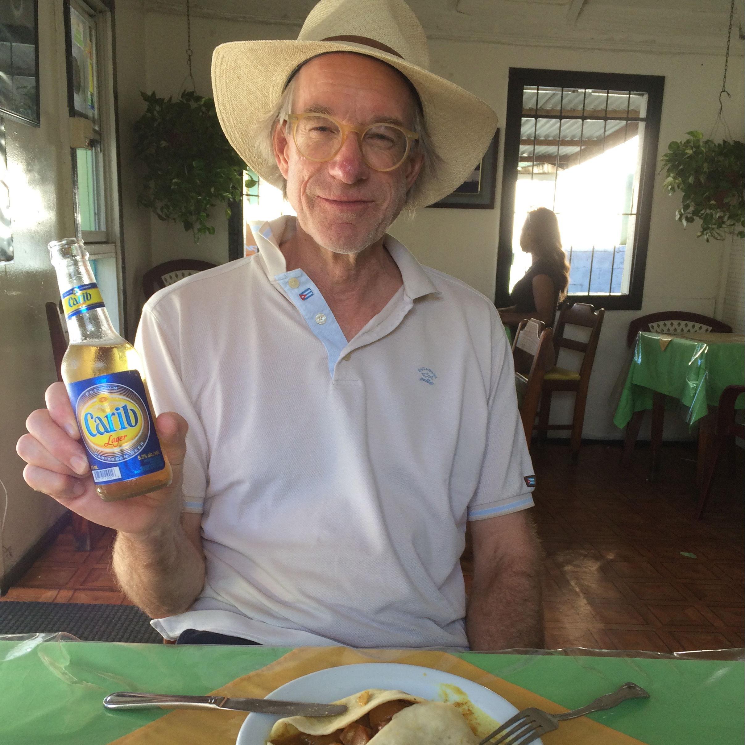 Enjoying a cerveza (and roti!) at The Roti King, St. Johns. Antigua, 2015