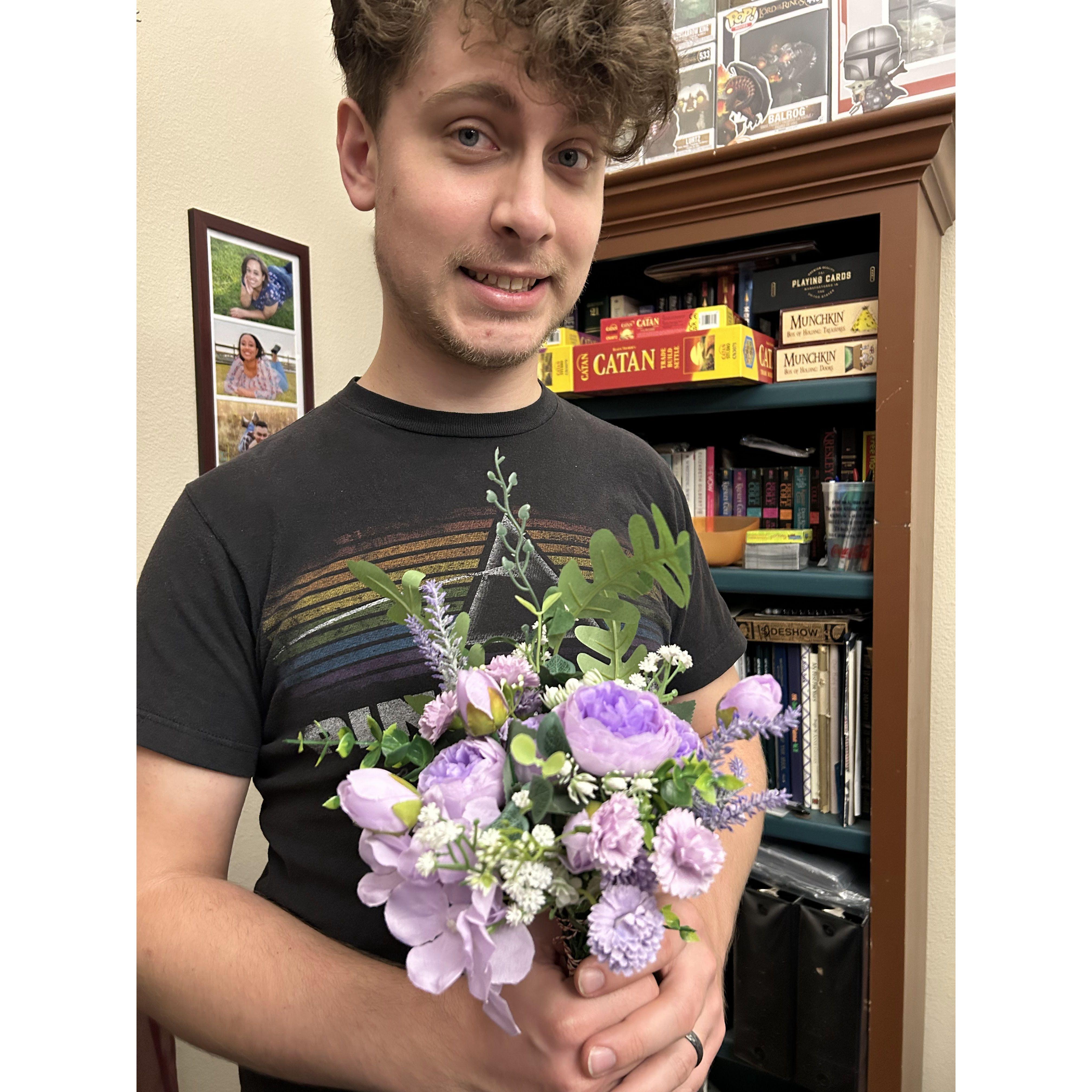 Jackson modeling the bridesmaid bouquets!