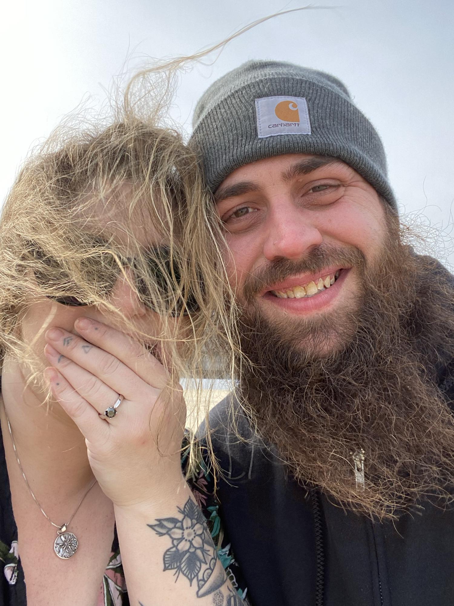 HE POPPED THE QUESTION!!! Beach wind in Laura’s hair and all 🥰