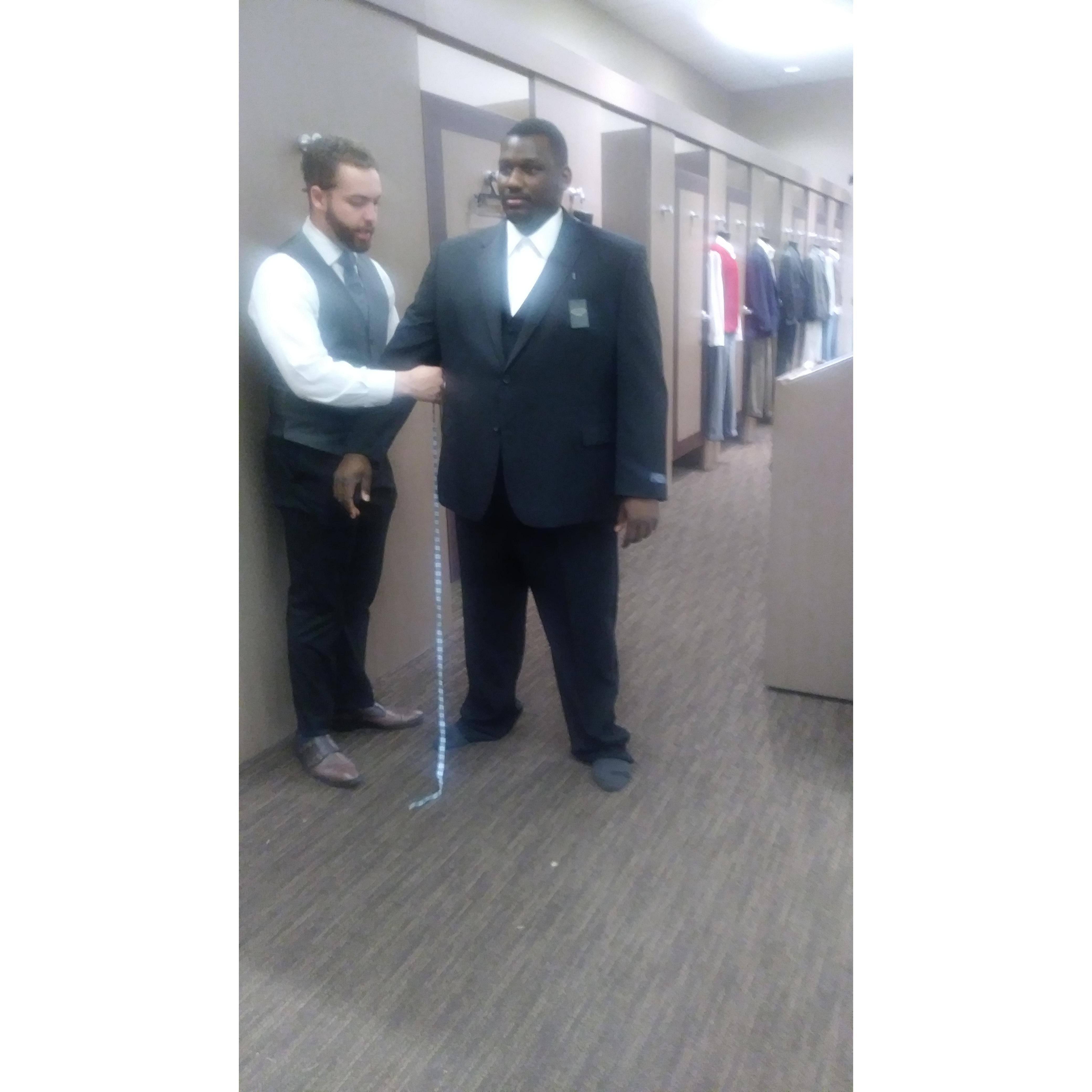 The groom getting fitted