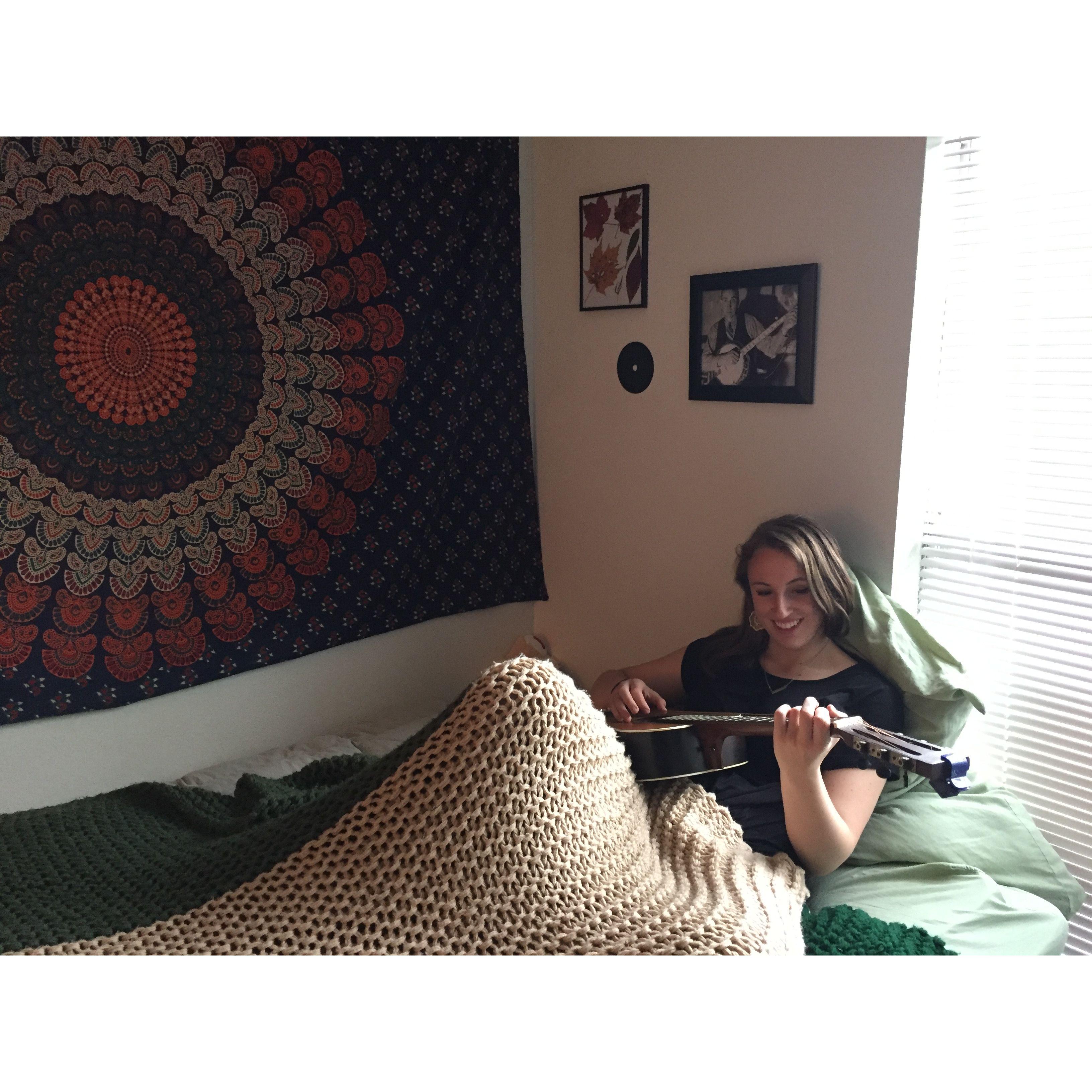 Maggie playing guitar.