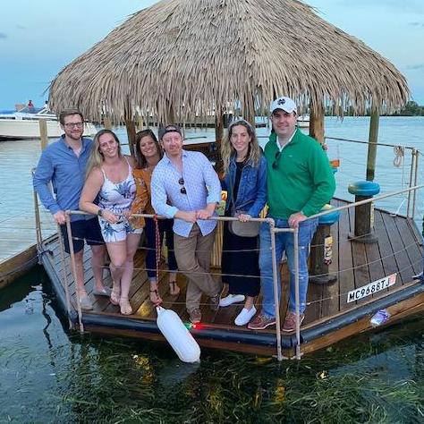 Brendan, Lindsey, and friends on a Tiki boat in Detroit.