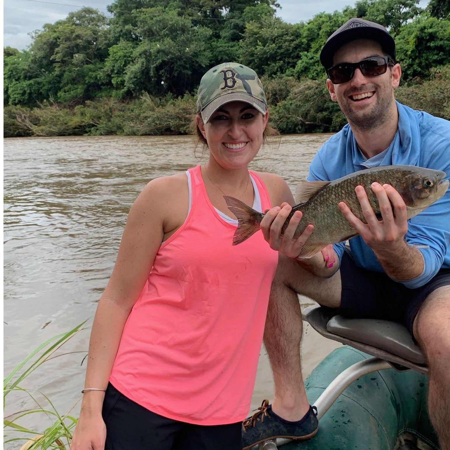 Fly fishing in Costa Rica. Grant catches a Machaca and Kaila is impressed.