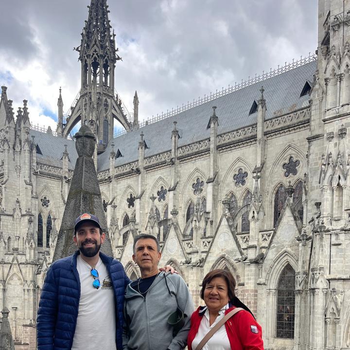 Quito - Michael, Robert, and Narcisa standing by the Basílica del Voto Nacional — a place as grand as their smile. Did you know this basilica is the largest neo-Gothic church in the Americas?