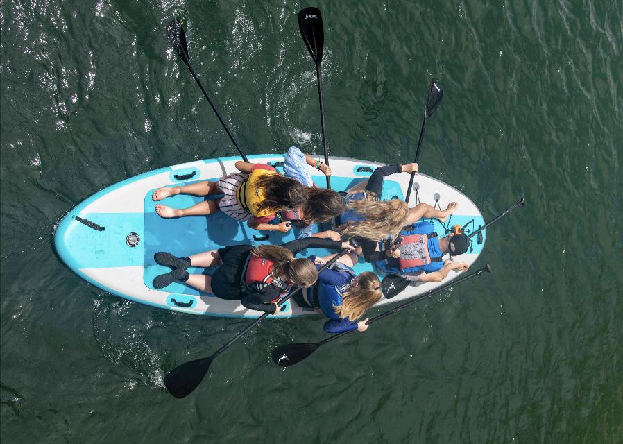 Mark proposed on a jumbo sup at Pilar Point Harbor. 
We all paddled out and managed to not fall in! Thank you Uncle Felix for capturing  this photo of us.