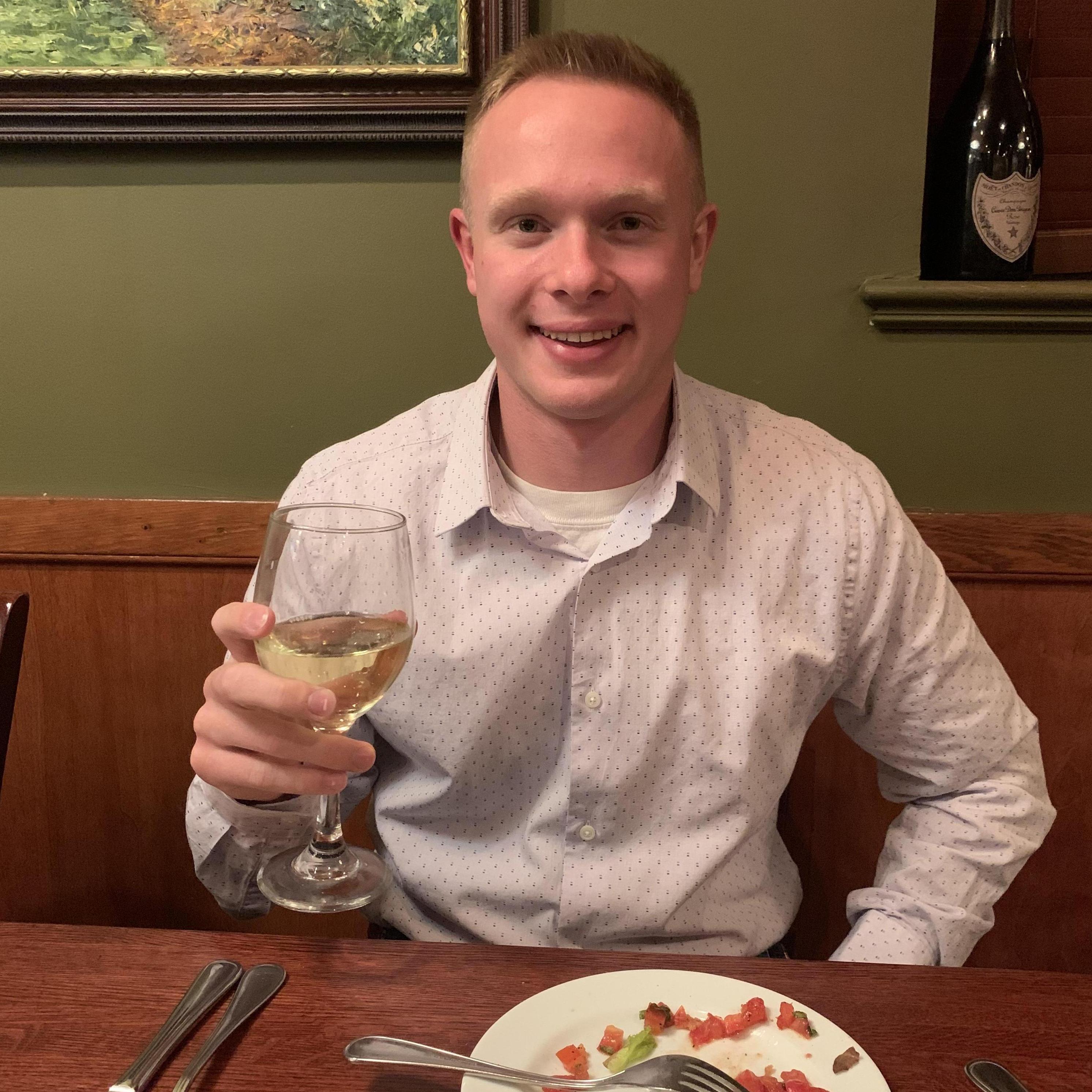 My handsome husband-to-be at dinner. We ordered a bottle of wine and we vowed to drink it every year on our anniversary and on our wedding day.