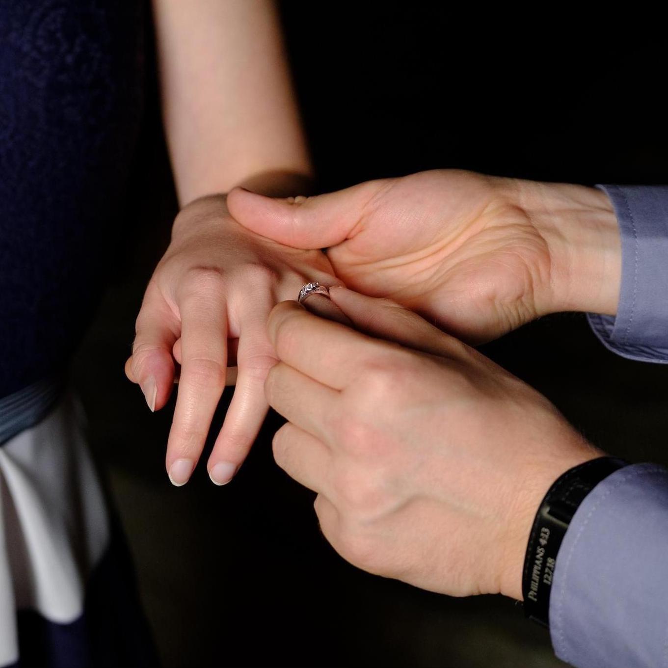His bracelet and my ring have the same Bible inscriptions