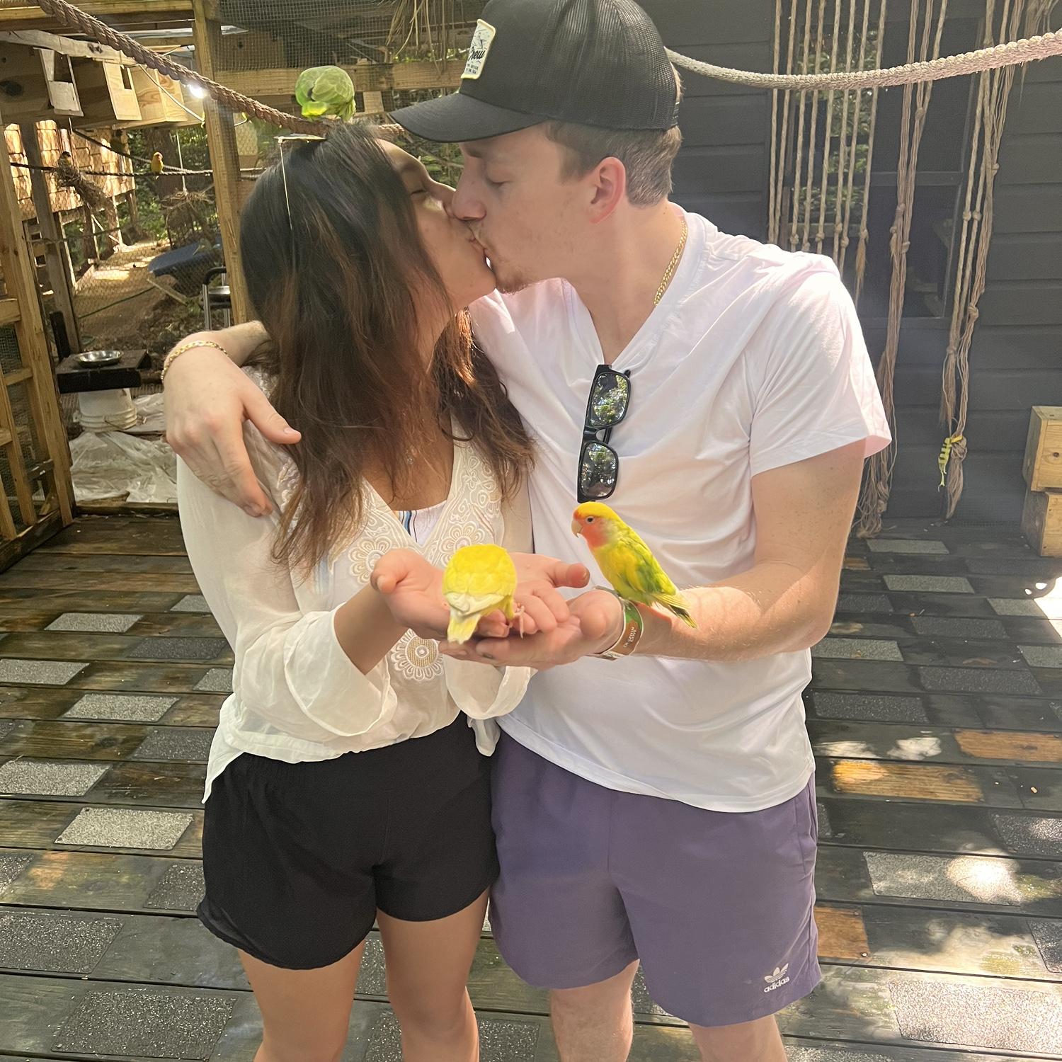 In Jamaica holding love birds 🦜 🦜