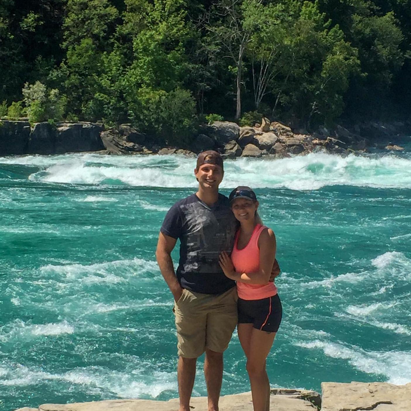 Be that person who offers to take a picture of the struggling couple!