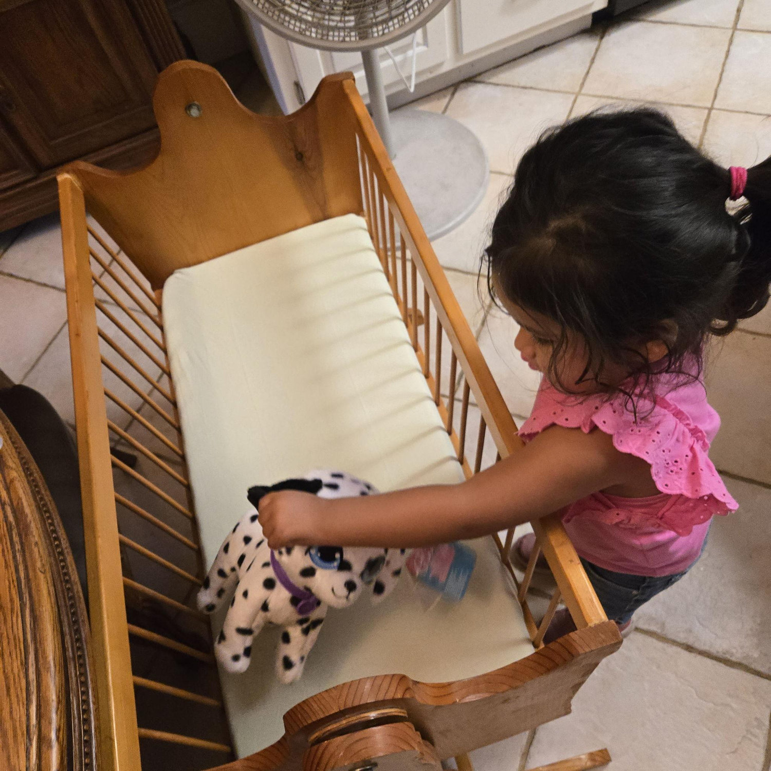 Victoria helping set up the baby's bassinet.