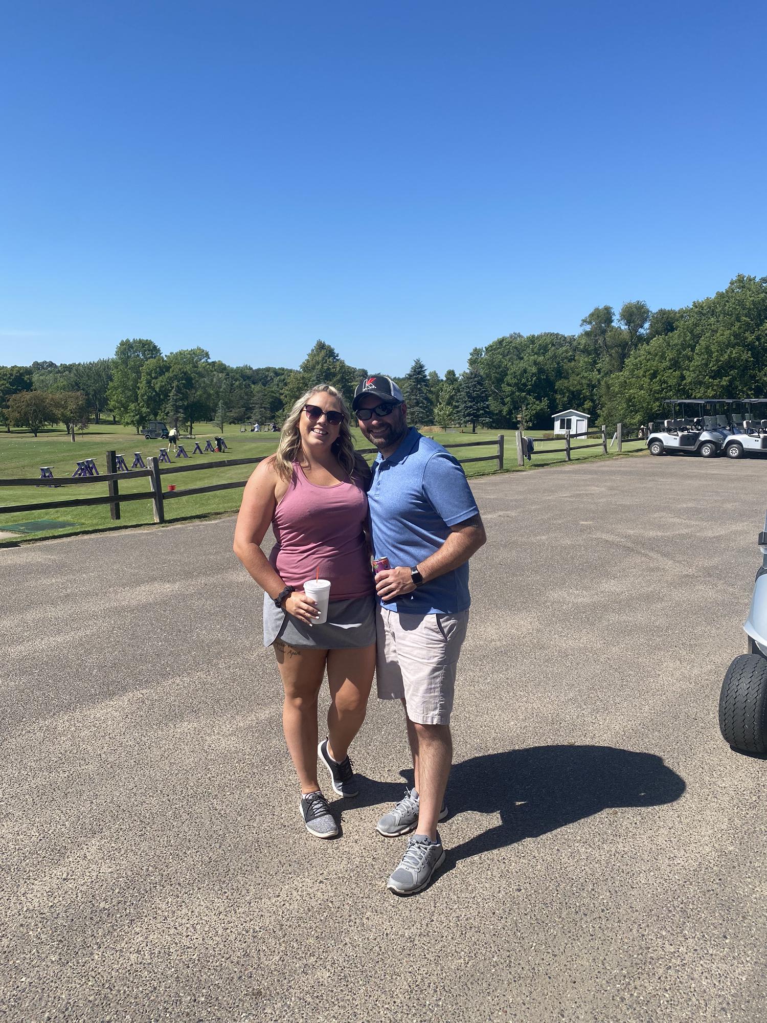 Tiff golfs while Eric drives the cart 💞