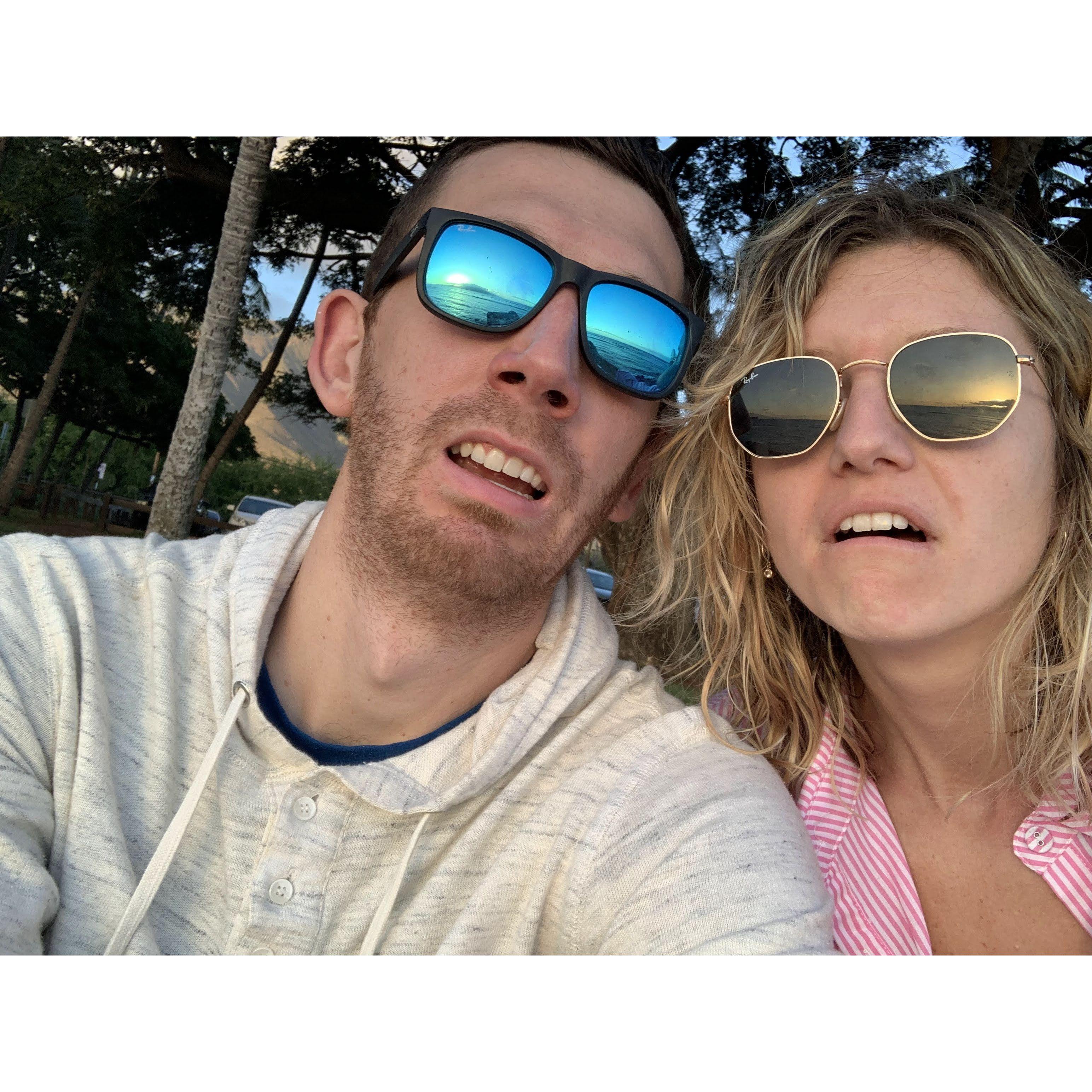Just two attractive people watching the surf in Maui.