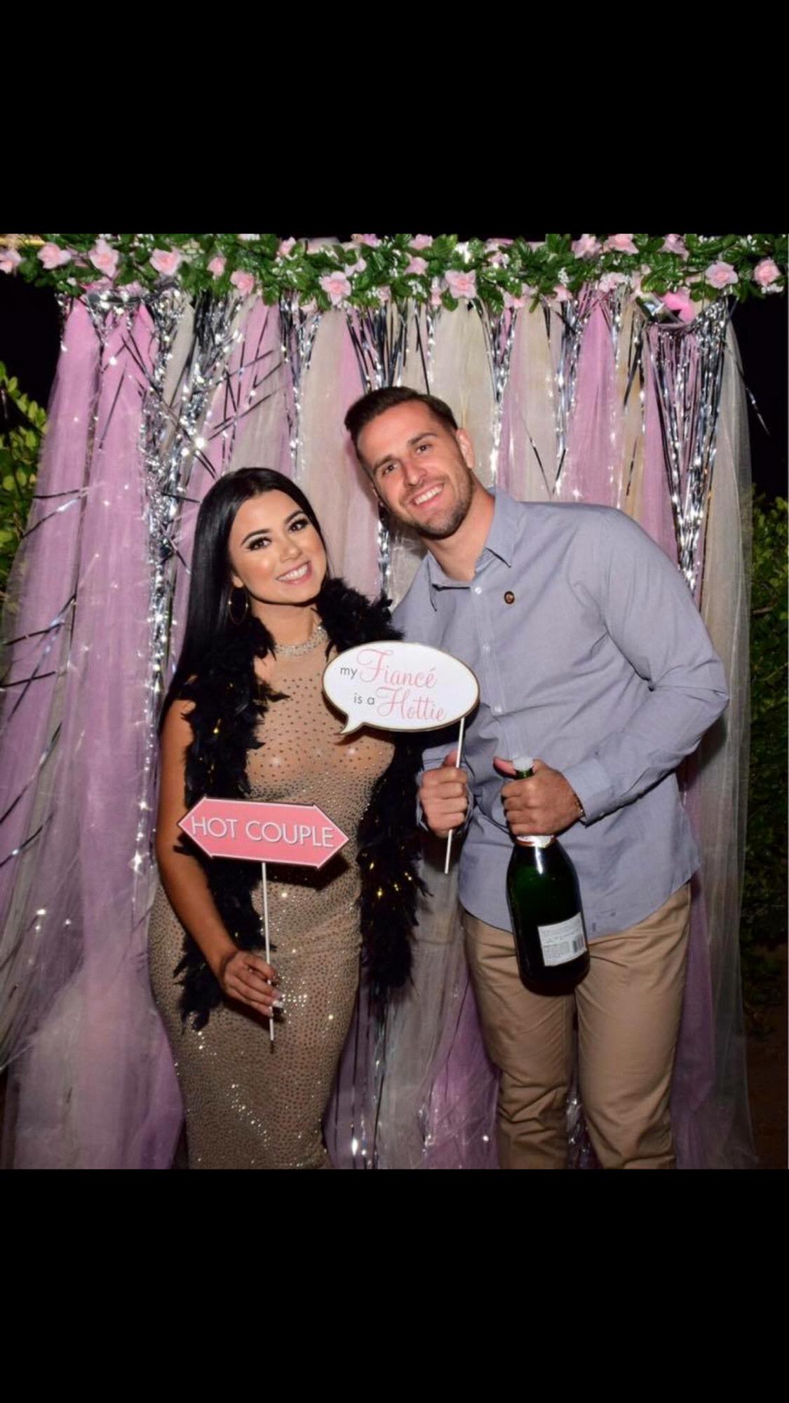 Captured in engagement party selfie station