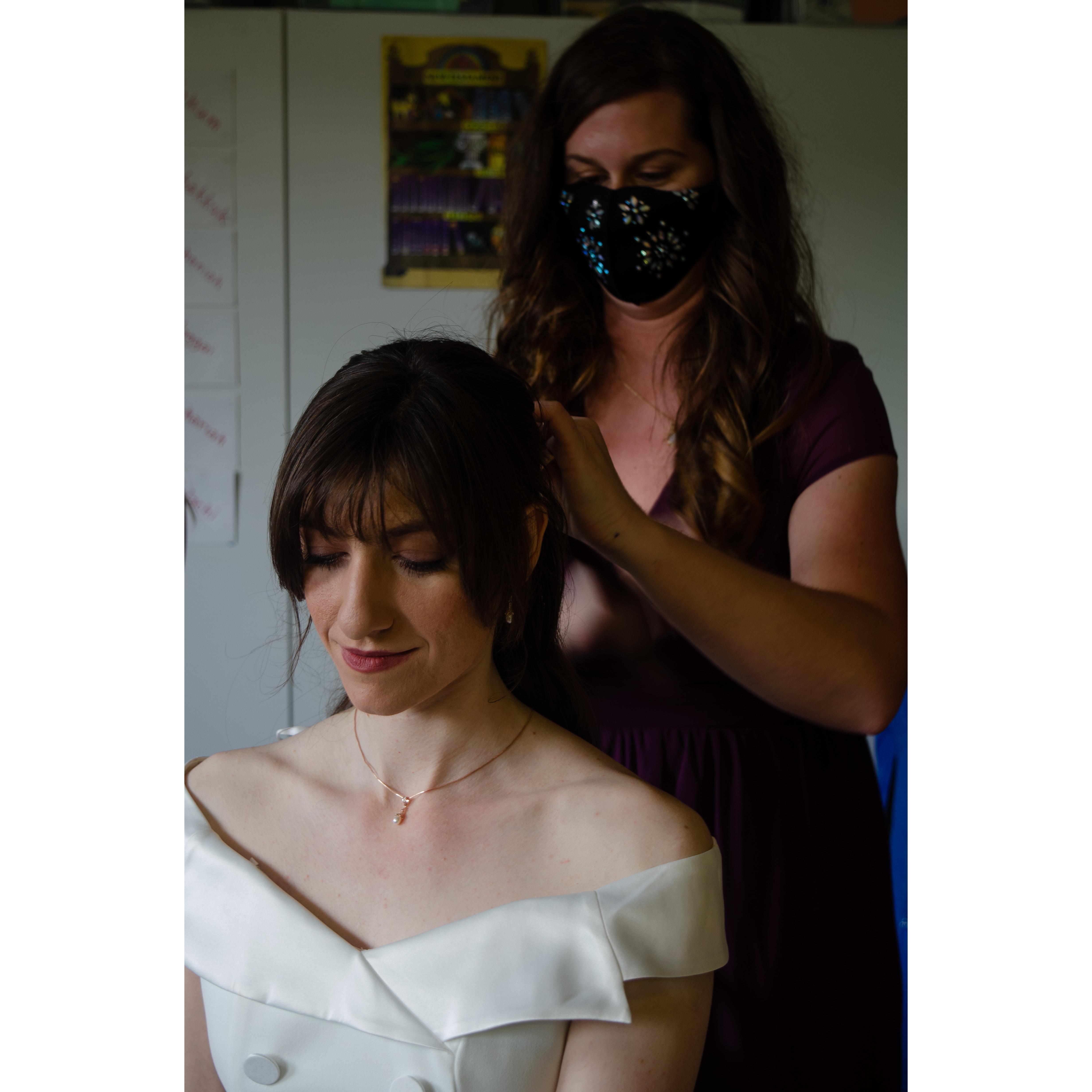 Matron of Honor Melissa Knapp helping Maxine with her veil.