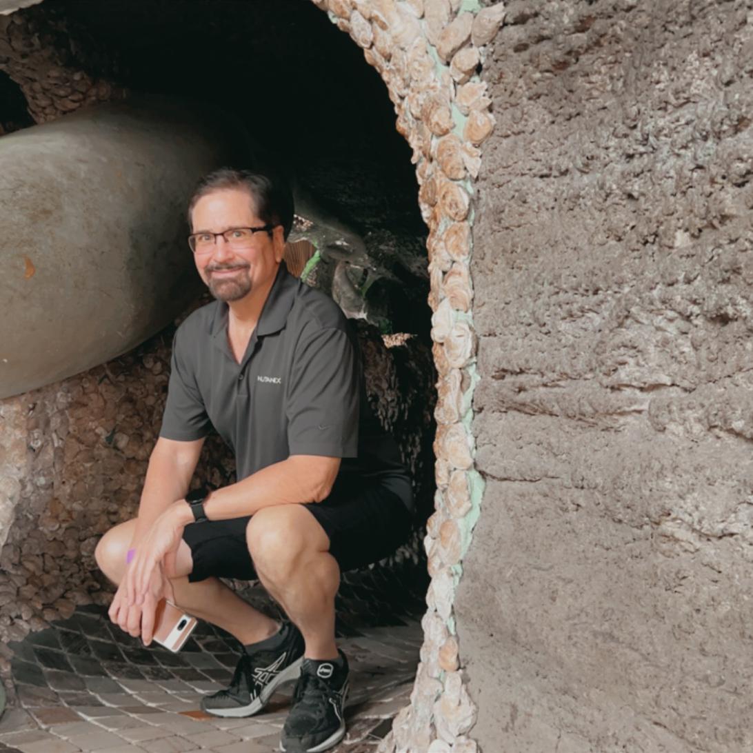 Jon squatting in the entrance of yet another tunnel in the City Museum. We got lost in one of them. Lol