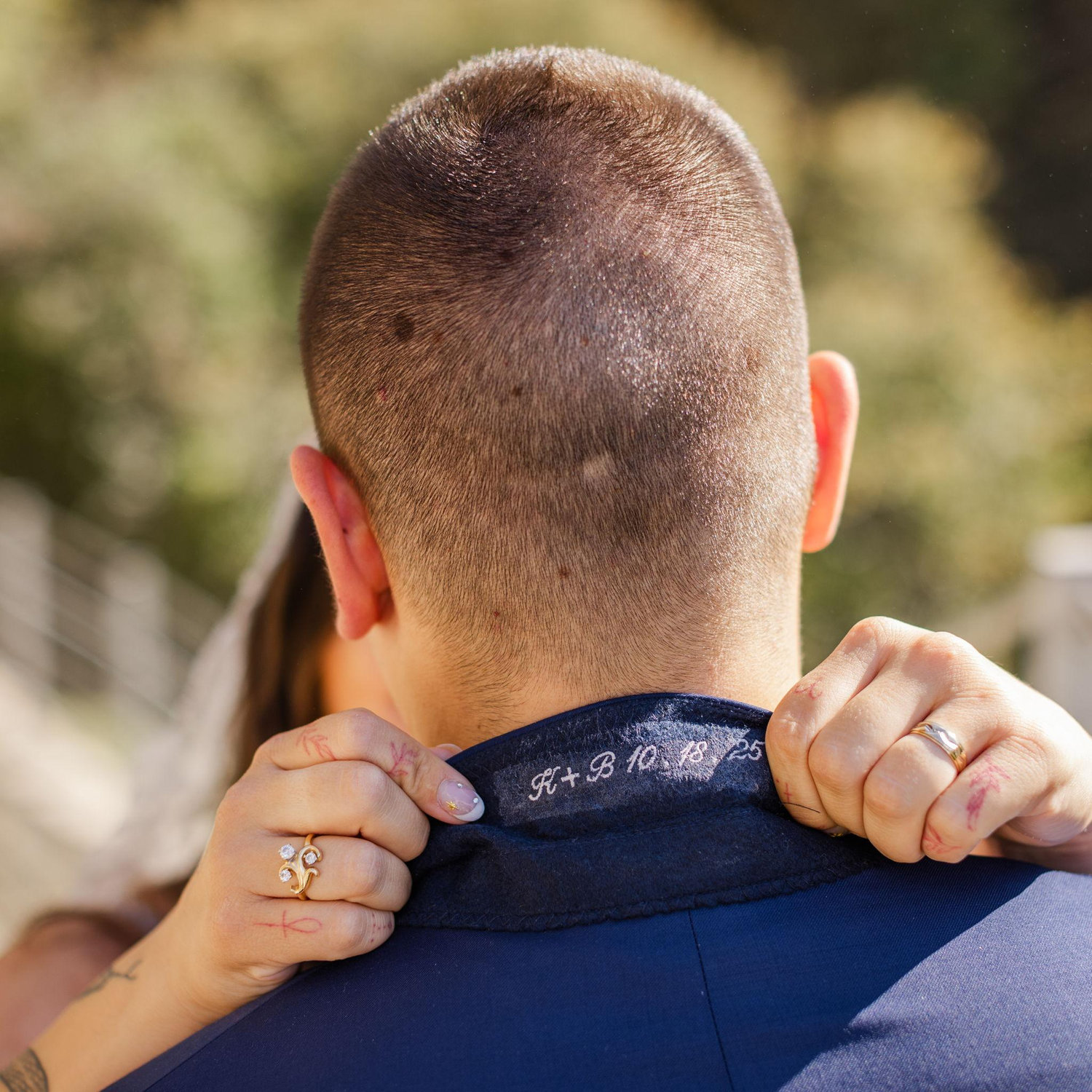 Our initials and wedding date sewn into the groom's tux.