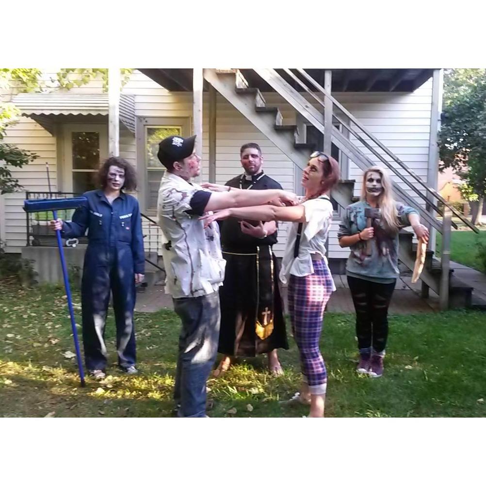 Zombie wedding...

This picture is so hysterical to us, and such a foreshadowing with Chuck being our zombie wedding and real wedding officiant <3