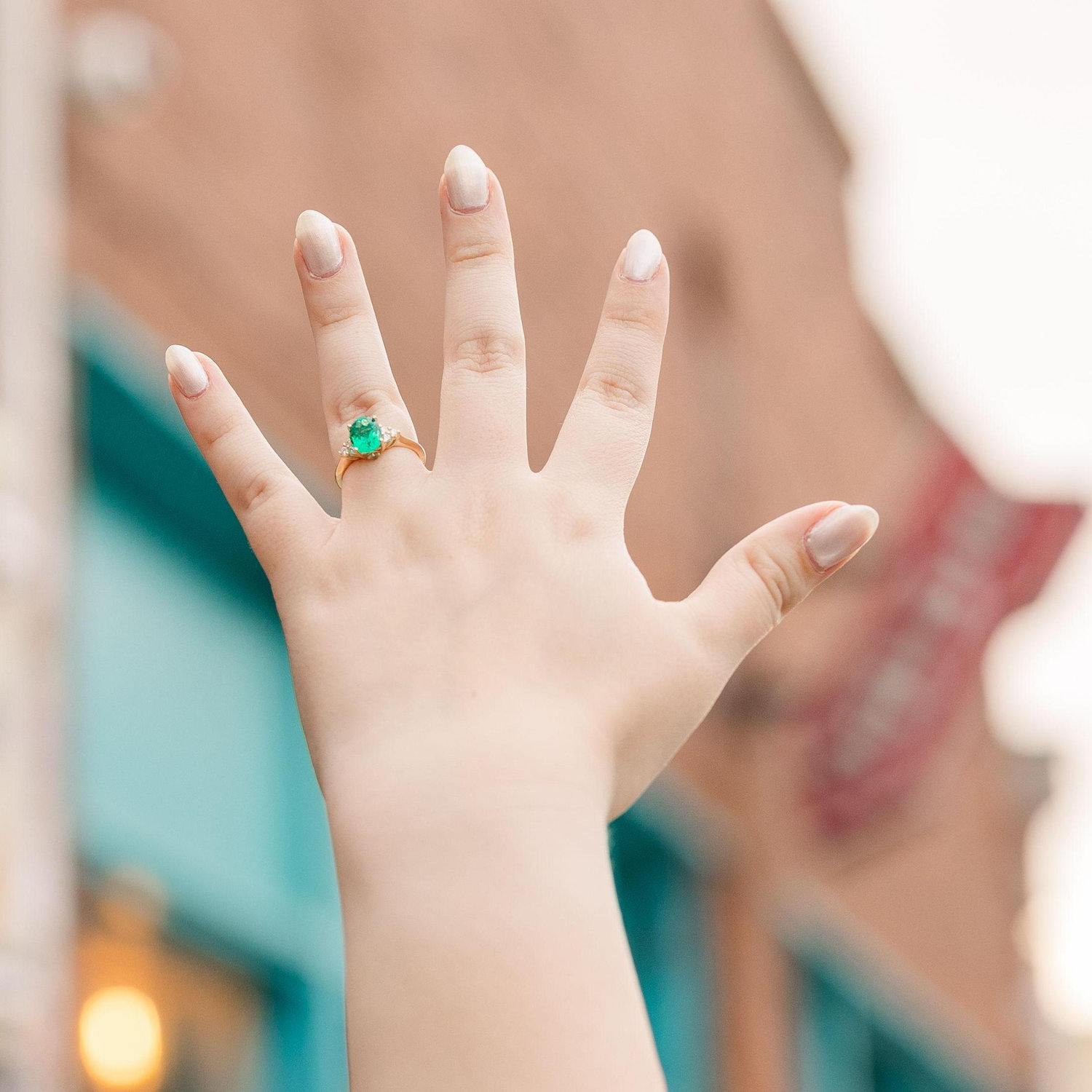 We designed the engagement ring together — emerald for Henry's birthstone, moonstones on the floral-inspired bridge for Kalina's birthstone.
(Photo by Macy O'Connell Photography)