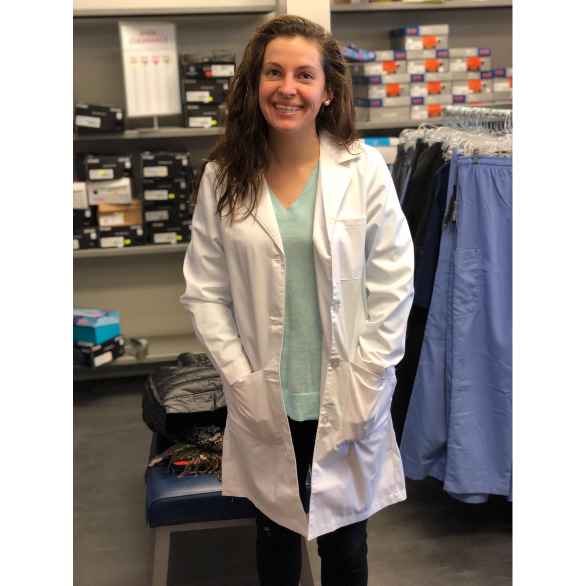 Year 3 - Abby trying on the long white coat for the first time!