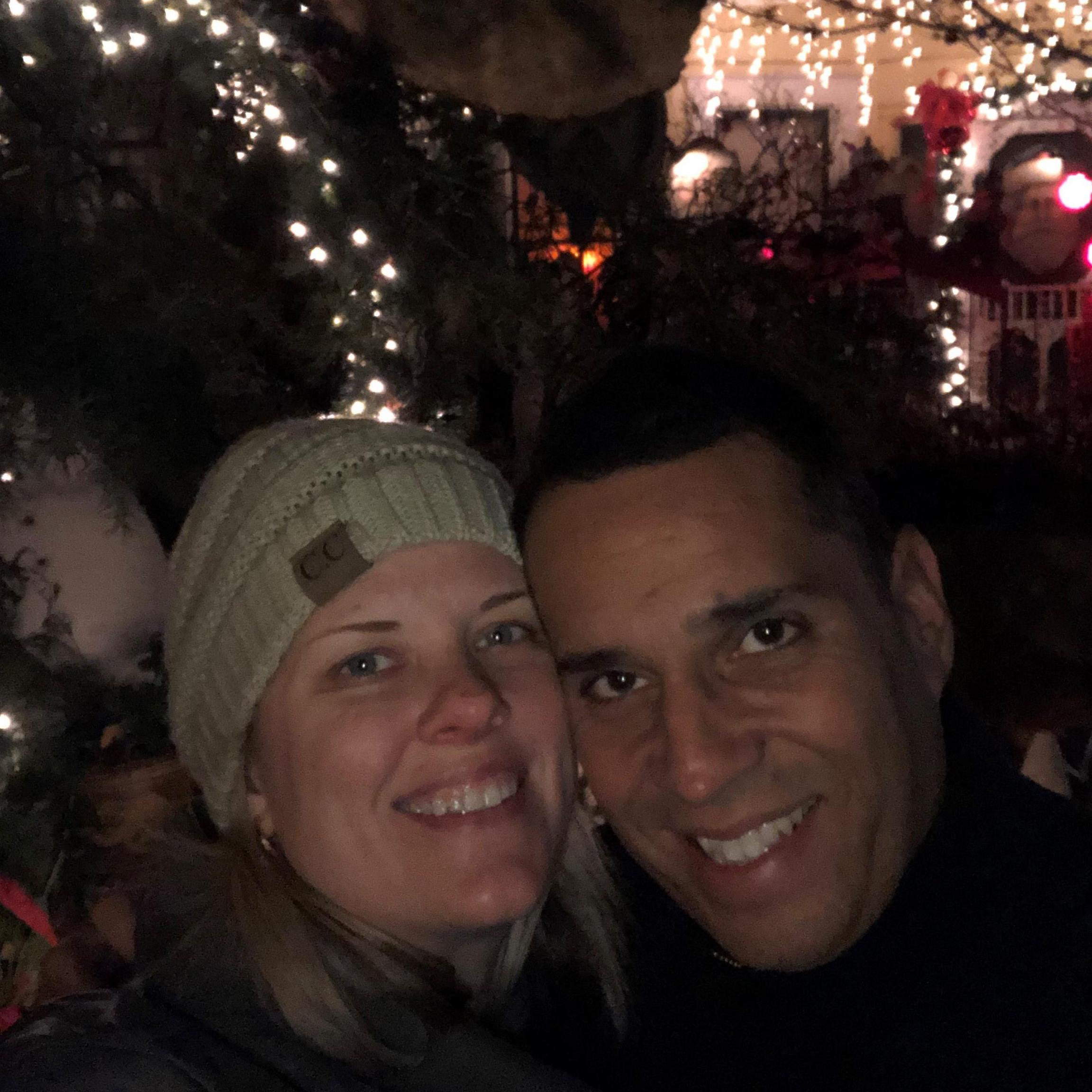 One year later- we're in front of the house where we got engaged!
