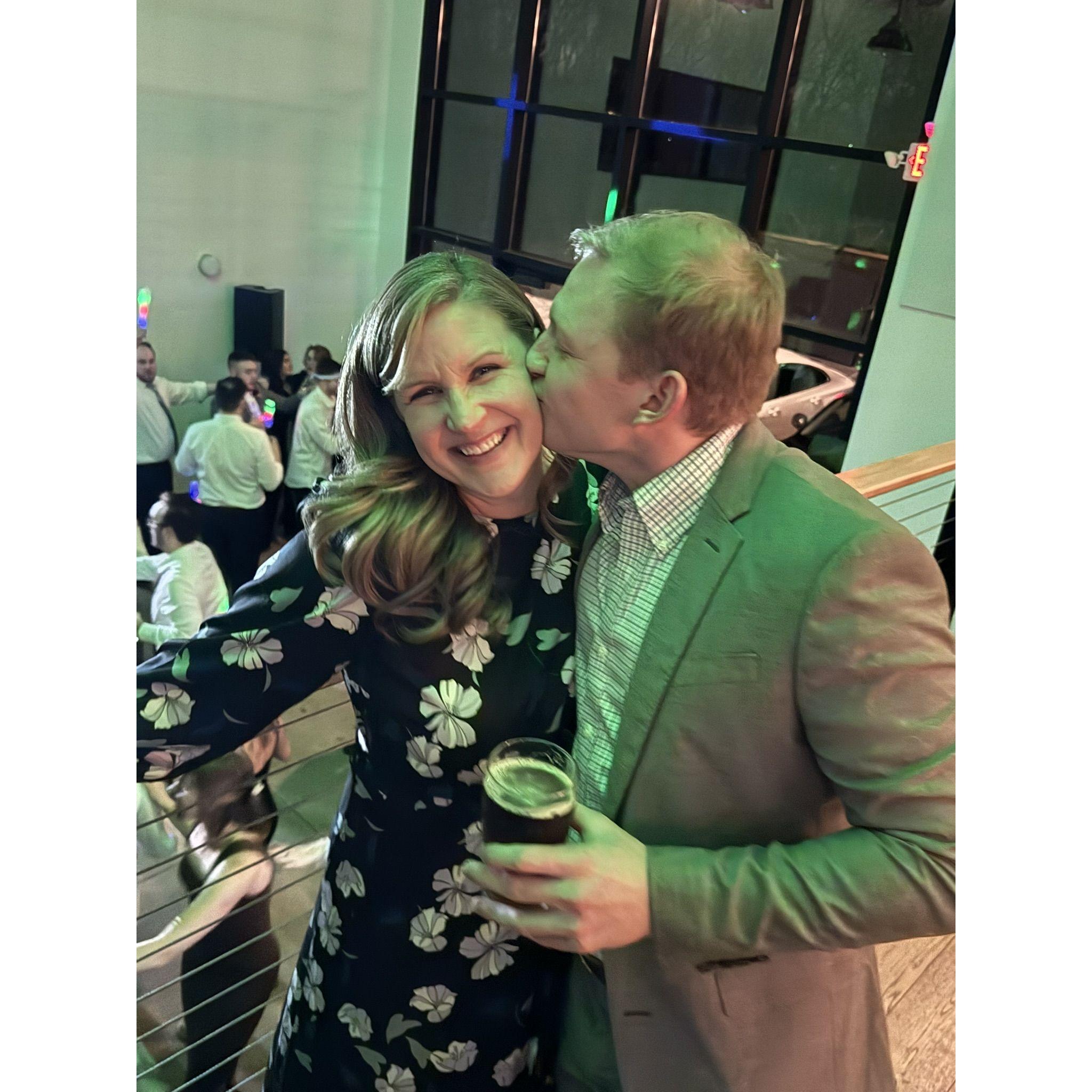 Ryan sneaking a kiss as we celebrate at a family wedding reception.