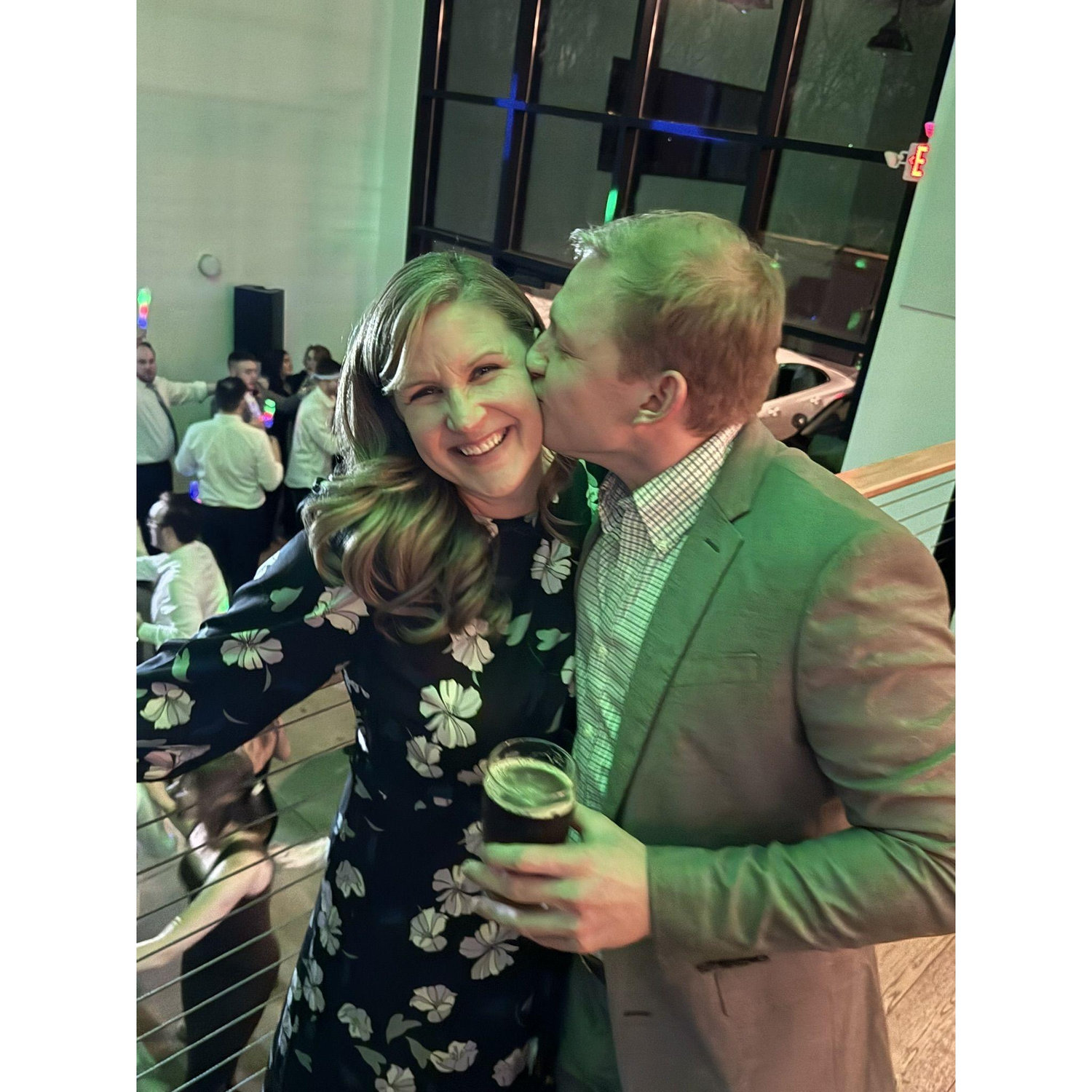 Ryan sneaking a kiss as we celebrate at a family wedding reception.