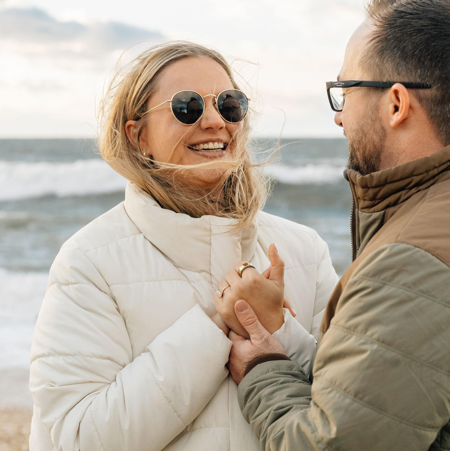 Colin proposed the day after Thanksgiving on the beach - in freezing temperatures and 30 mph winds