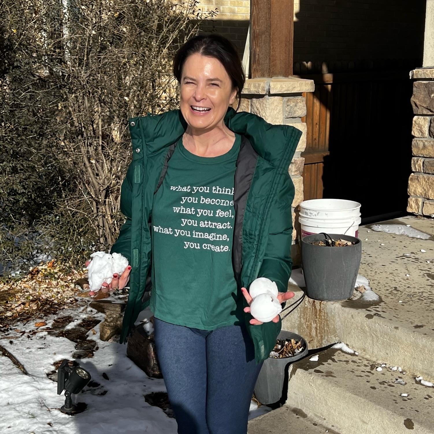 Kim enjoying the snow and having snowball "fights" with the neighborhood kids.