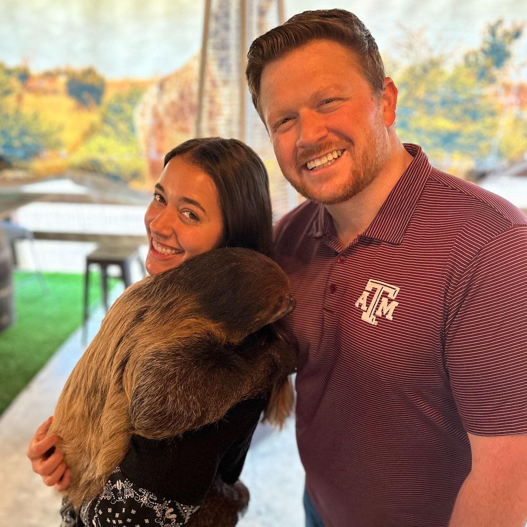 Holding a sloth! The best ever.