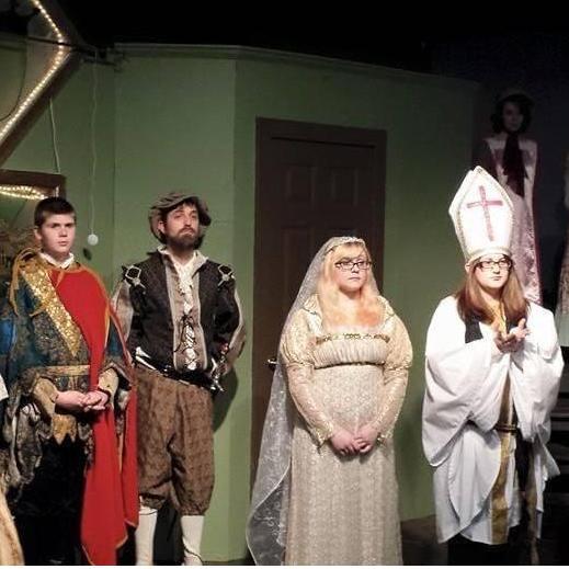 The bride & groom on the stage for The Princess Bride