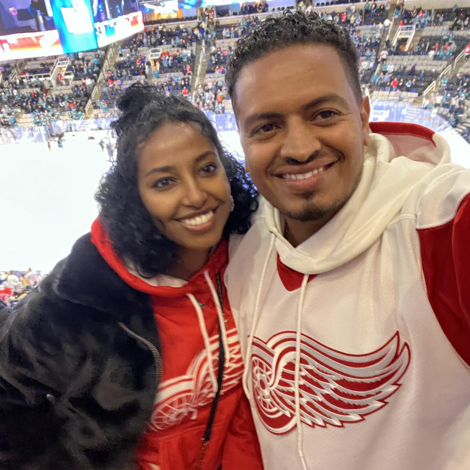 Detroit Red Wings vs. San Jose Sharks hockey game! Selam became a Red Wings fan by default...custom-made hoodie and all.