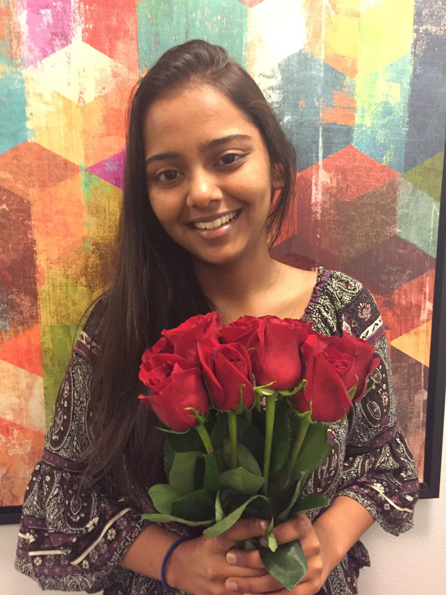 (Summer 2017) Avi surprises Kinjal with roses for the first time...it only took him 1.5 years...