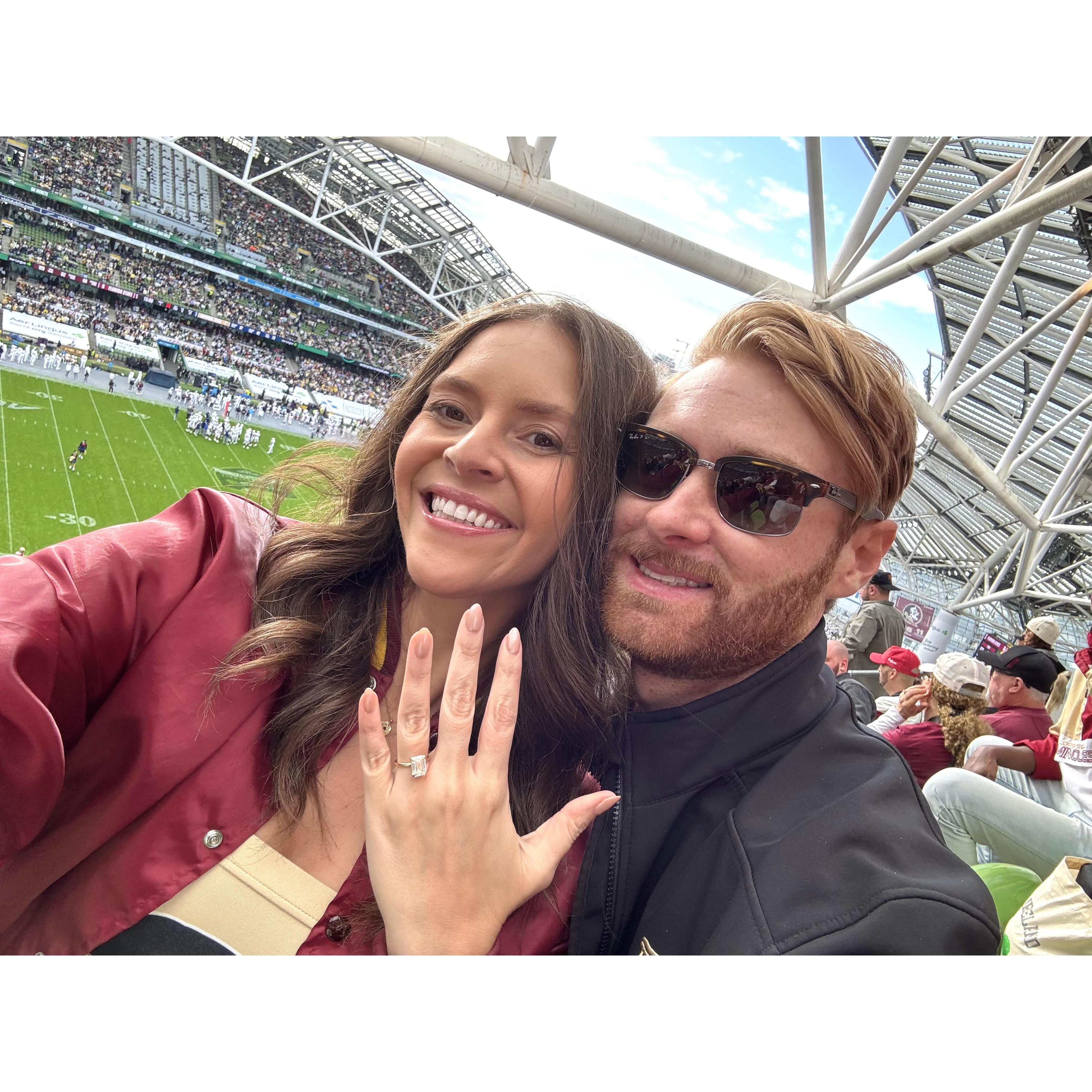 Celebrating our engagement watching FSU play in Ireland!