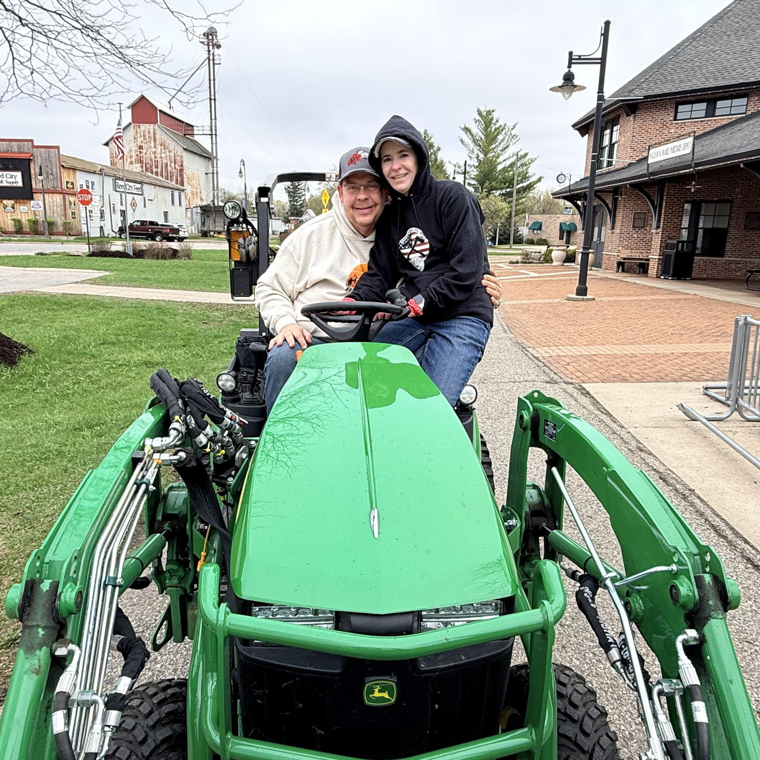Reed City Clean Up!  Roger, why can't I drive the tractor and you spread mulch??