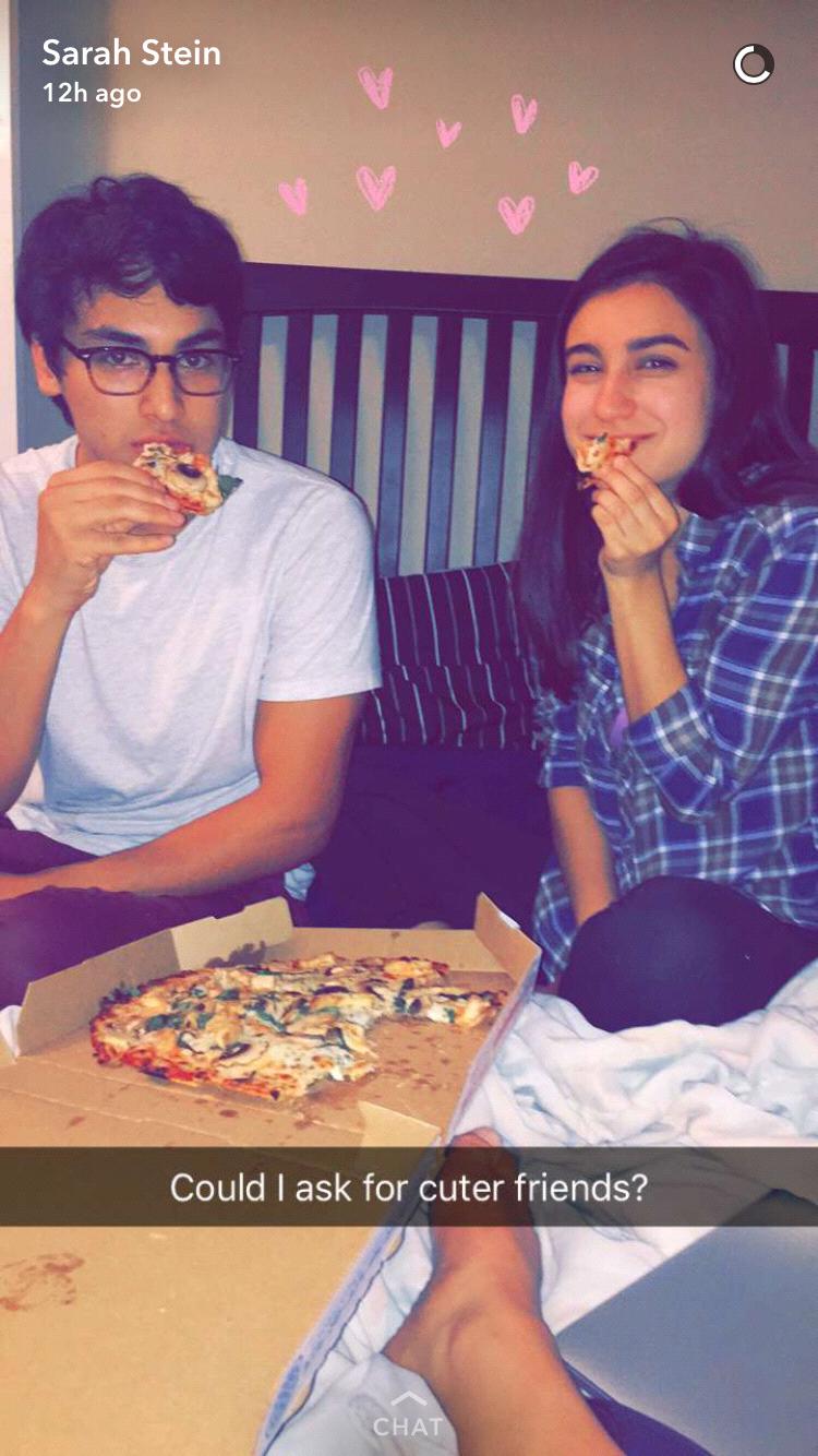 Chillin' on the bed with some 'za. Classic us.