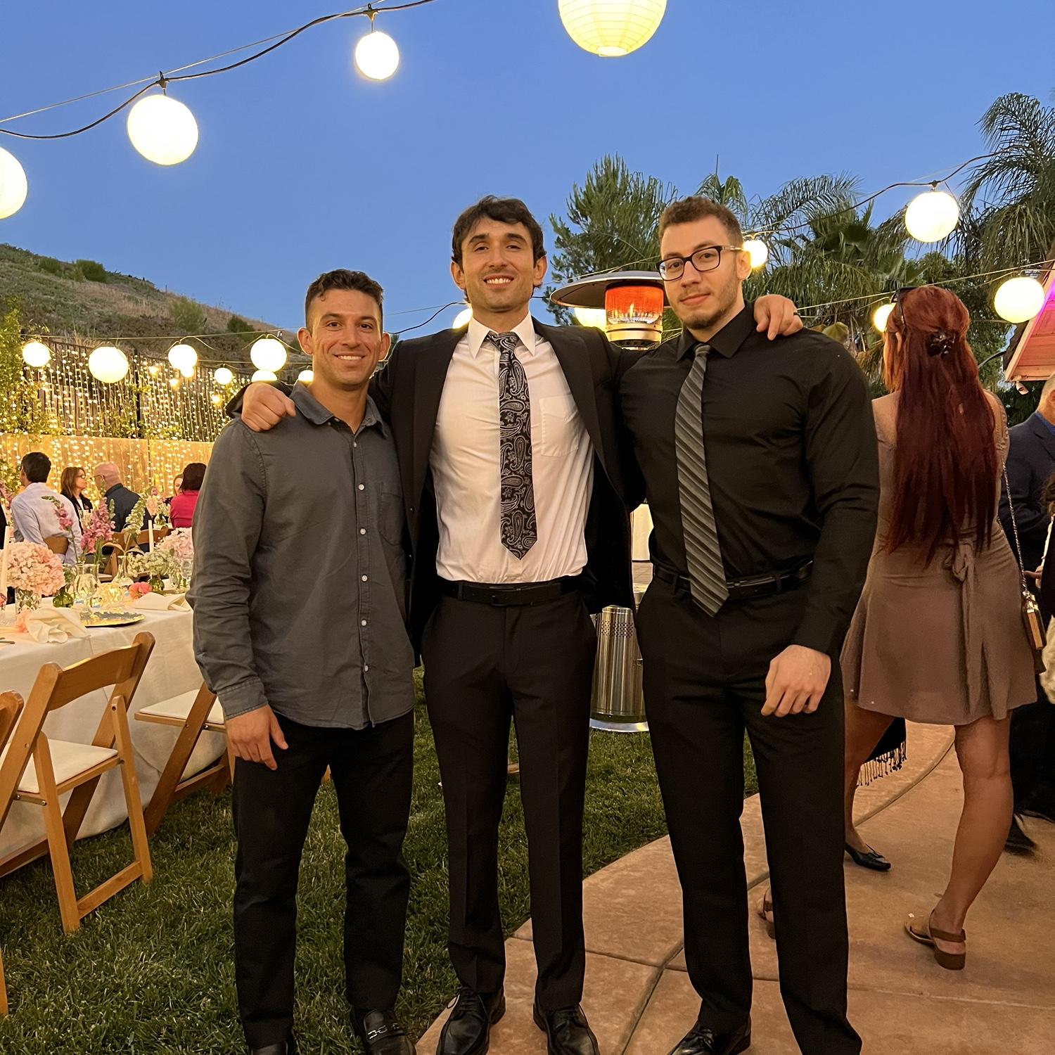 June 2022 - Alex with two of his groomsmen (G and Abdul) at our engagement party